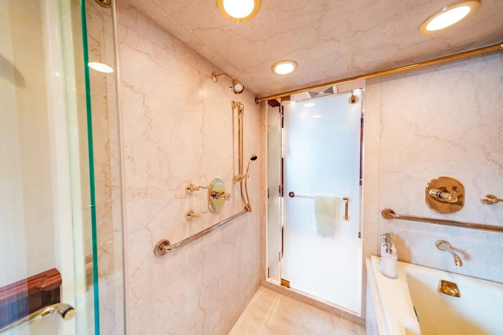 a bathroom with a sink and cabinets aboard LEGACY Yacht for Sale