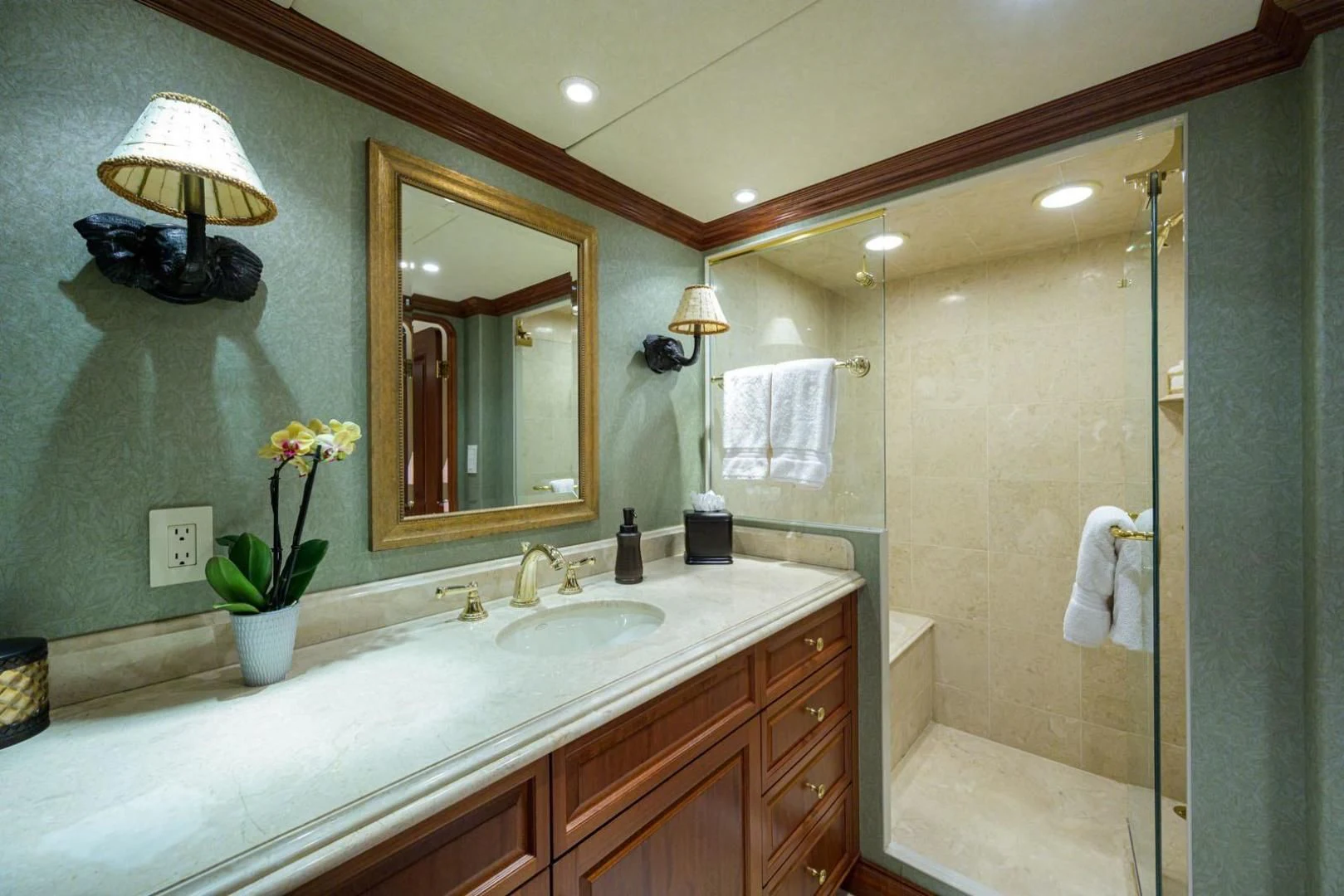 a bathroom with a shower and sink aboard LEGACY Yacht for Sale
