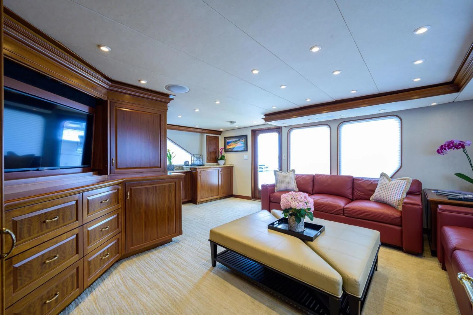 a living room with a couch and a table aboard LEGACY Yacht for Sale