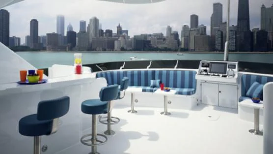 a room with a table chairs and a city skyline aboard LEGACY Yacht for Sale
