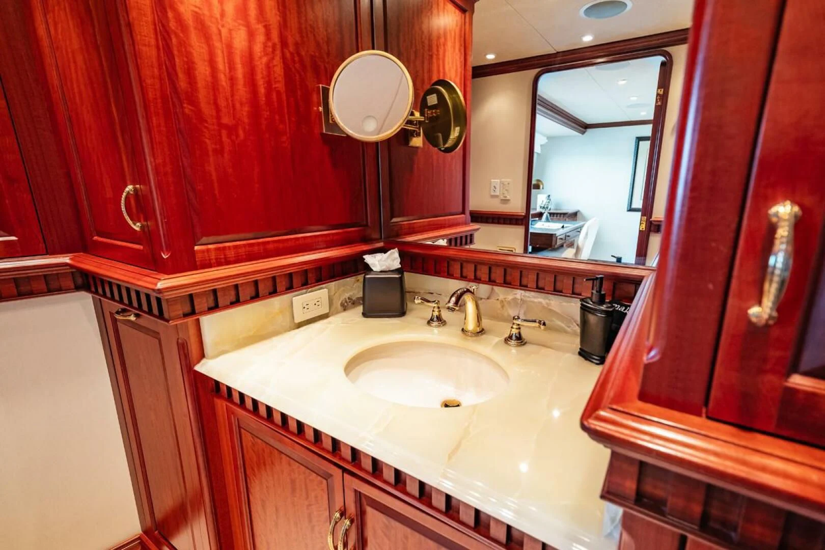 a bathroom with red walls aboard LEGACY Yacht for Sale
