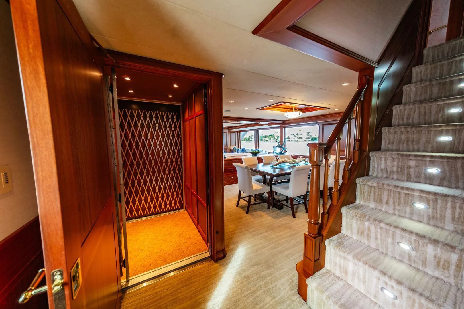 a staircase leading to a restaurant aboard LEGACY Yacht for Sale