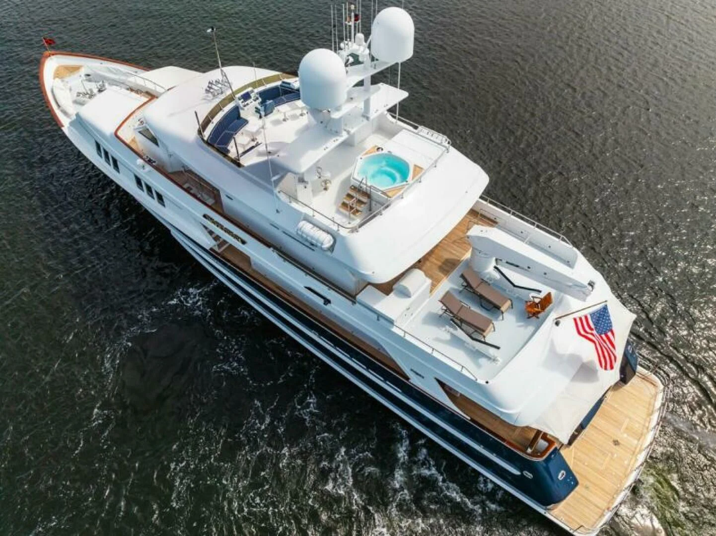 a white car with a white roof aboard LEGACY Yacht for Sale