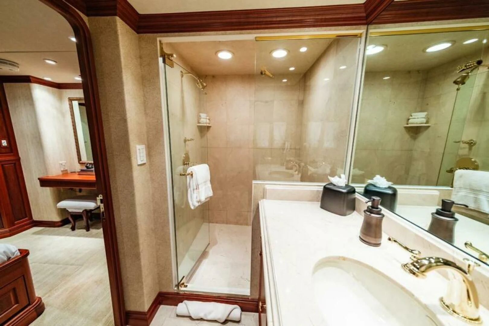 a bathroom with a large shower aboard LEGACY Yacht for Sale