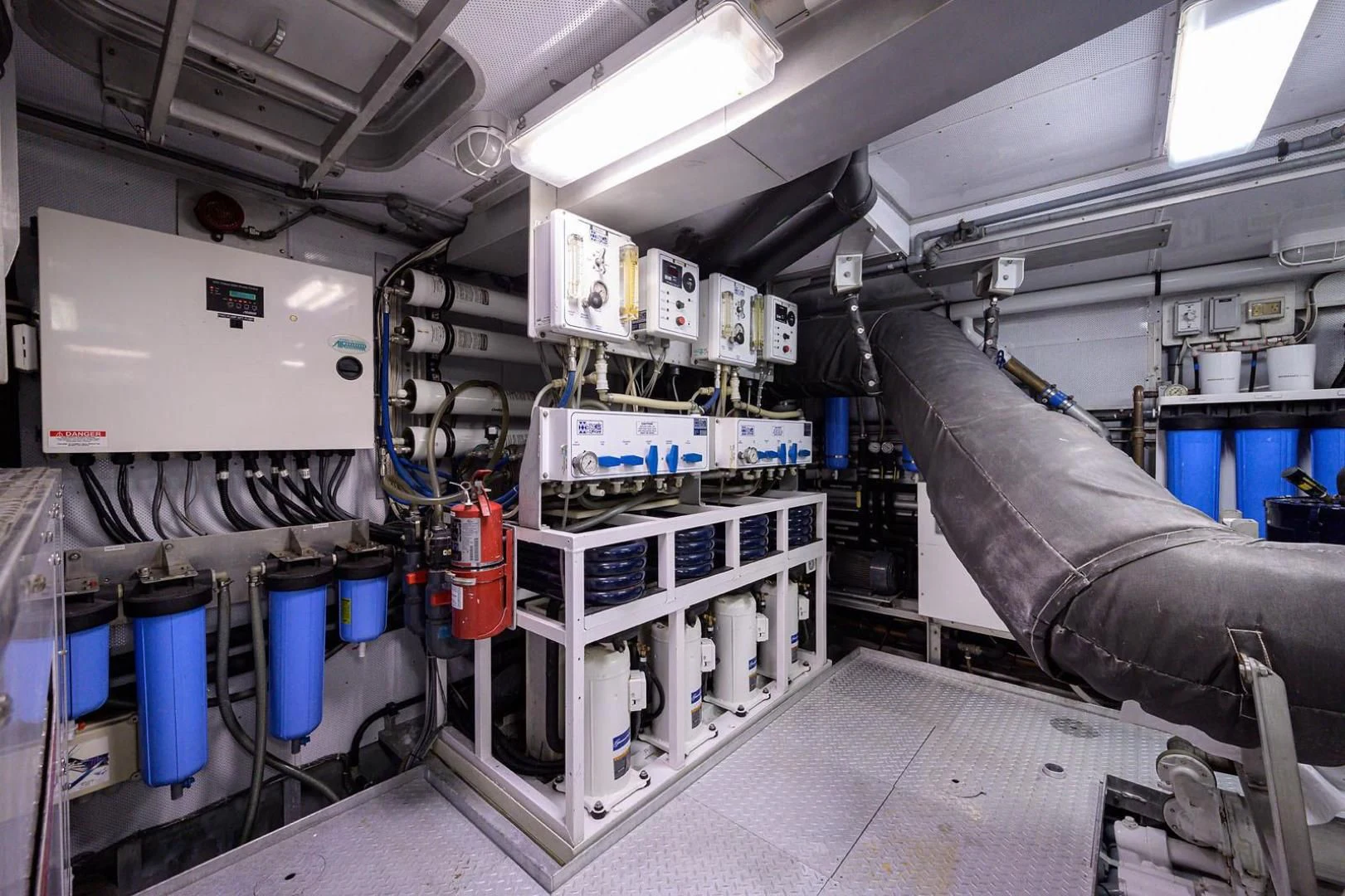 a room with machinery and pipes aboard LEGACY Yacht for Sale