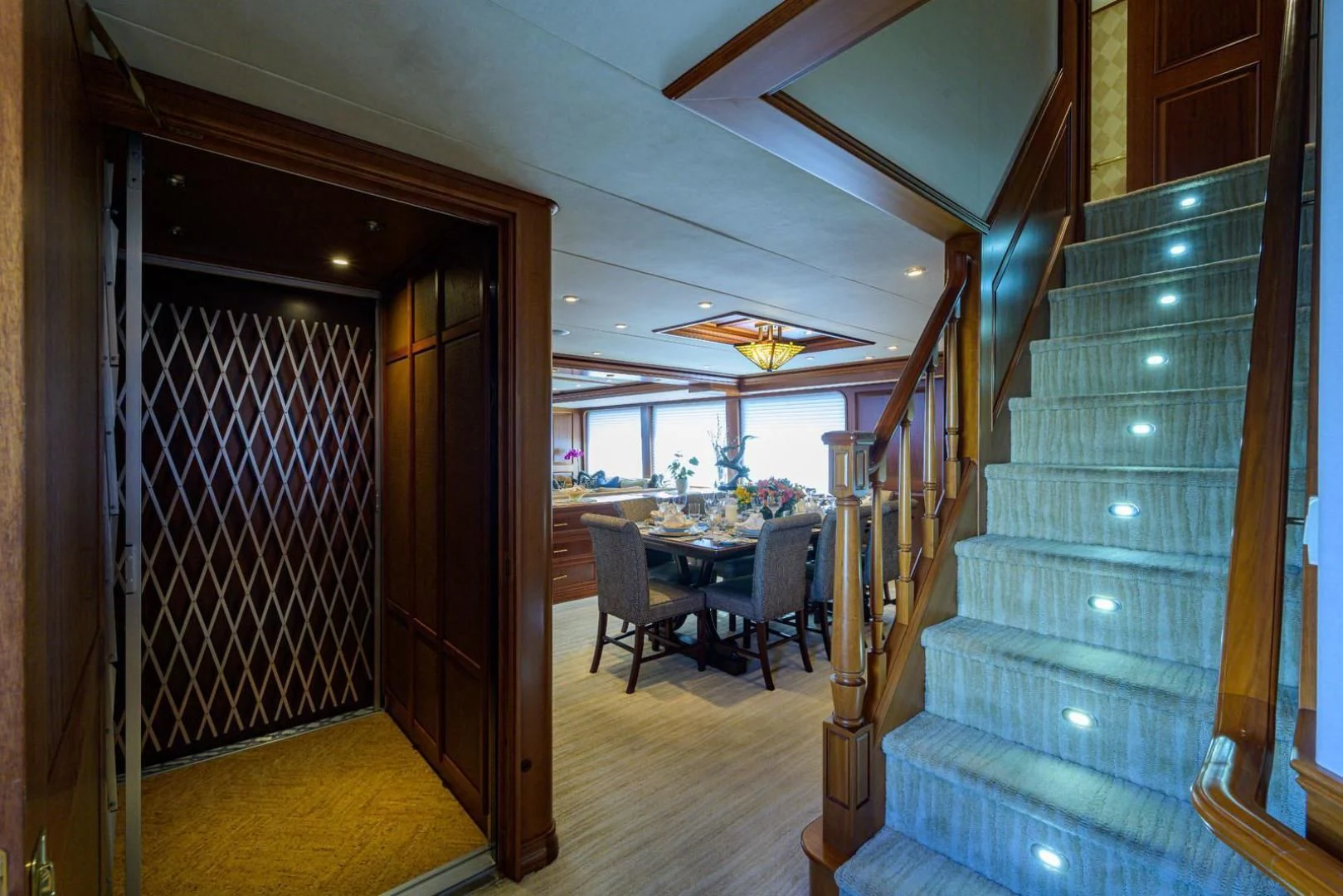 a room with a table and chairs aboard LEGACY Yacht for Sale