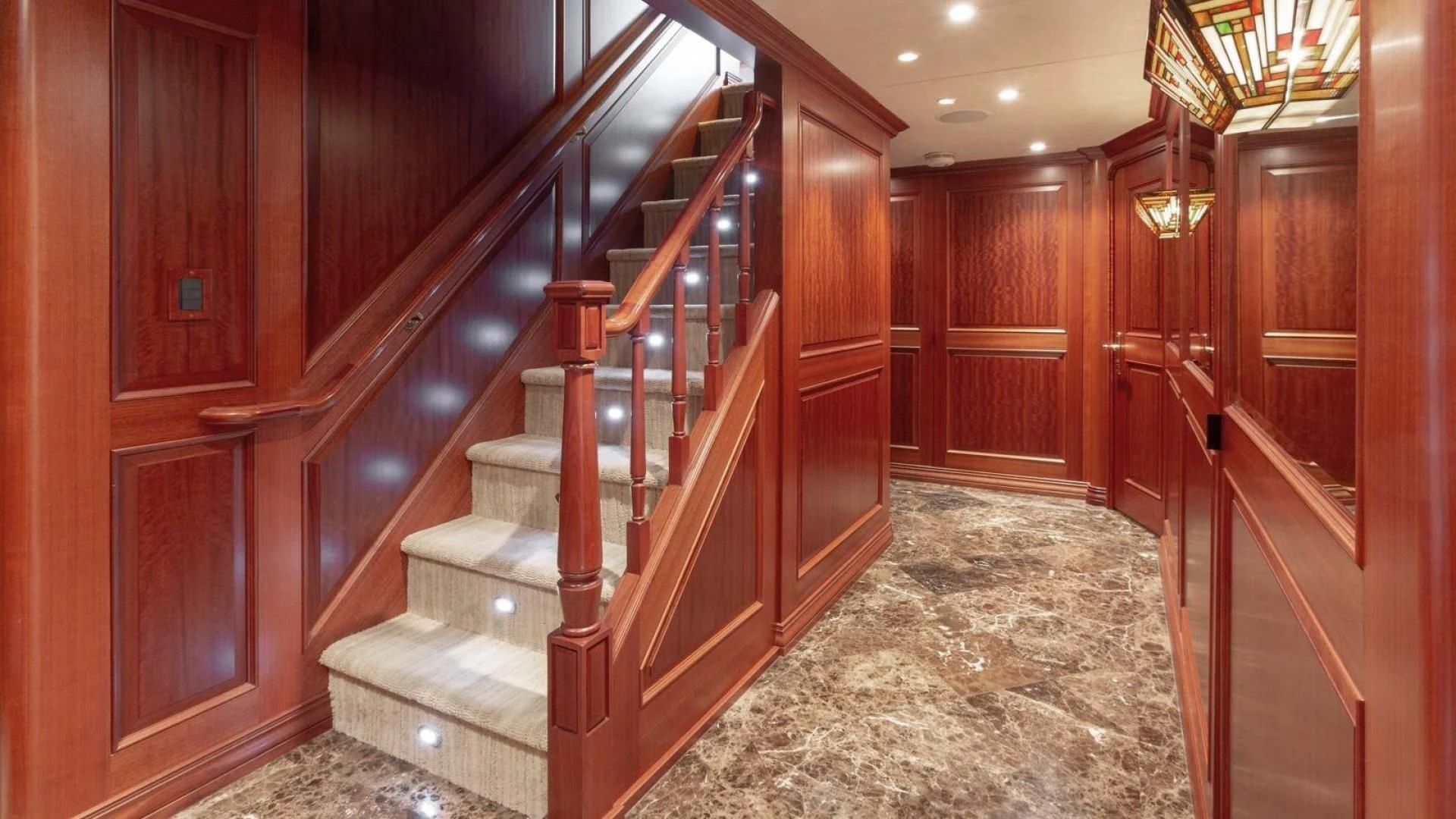 a staircase in a room aboard LEGACY Yacht for Sale