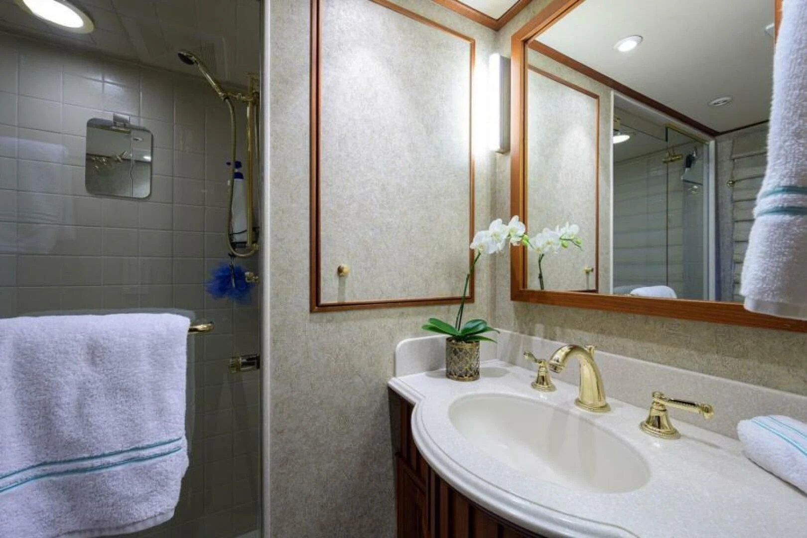 a bathroom with a sink and a mirror aboard LEGACY Yacht for Sale