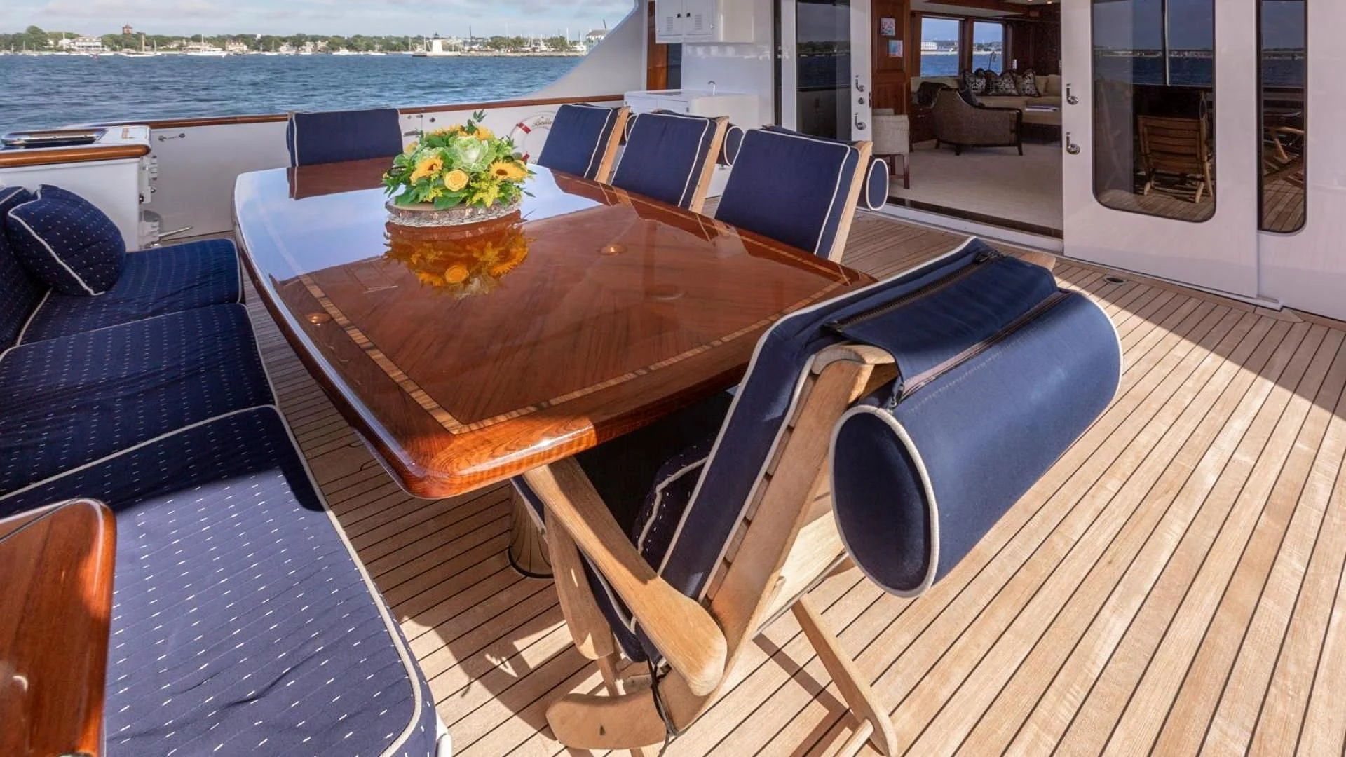a table on a deck aboard LEGACY Yacht for Sale