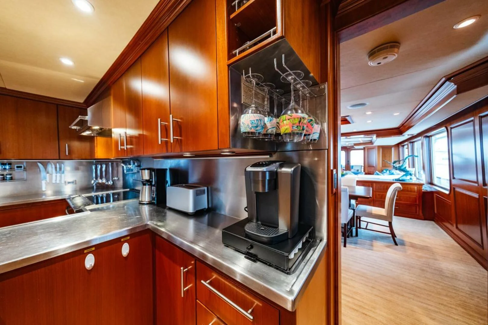 a kitchen with wooden cabinets aboard LEGACY Yacht for Sale