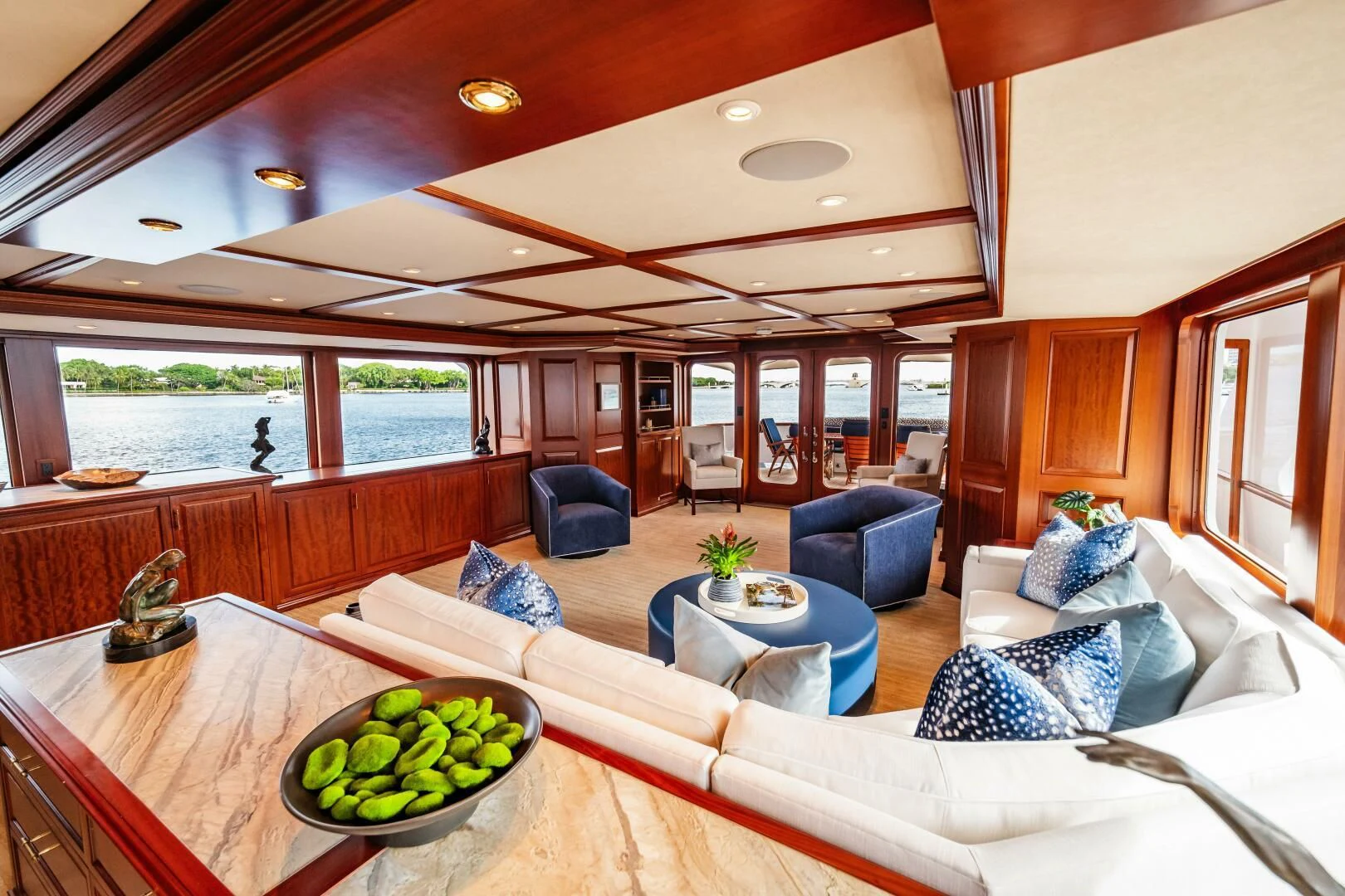 a living room with a large window aboard LEGACY Yacht for Sale