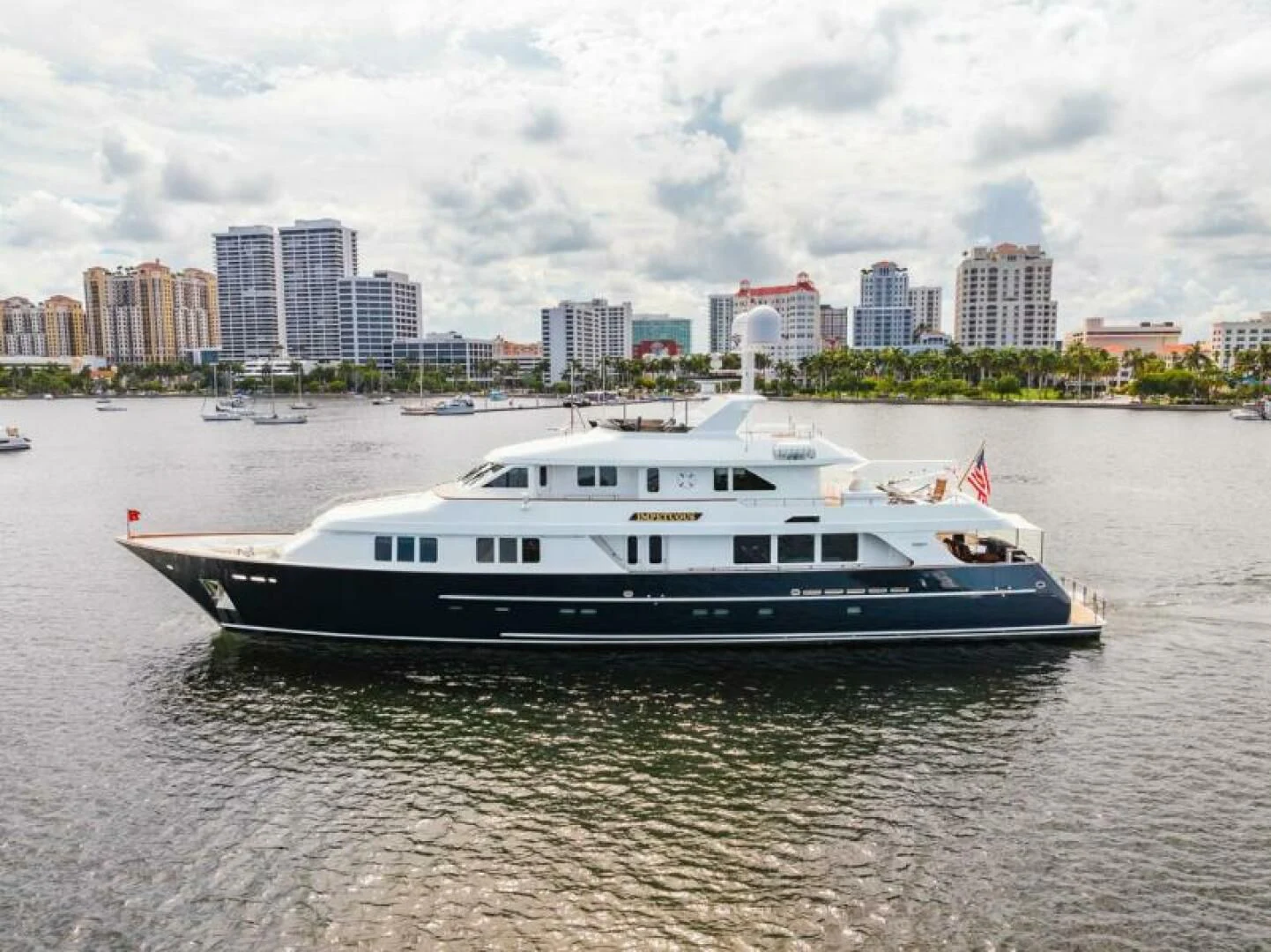a white boat in the water aboard LEGACY Yacht for Sale