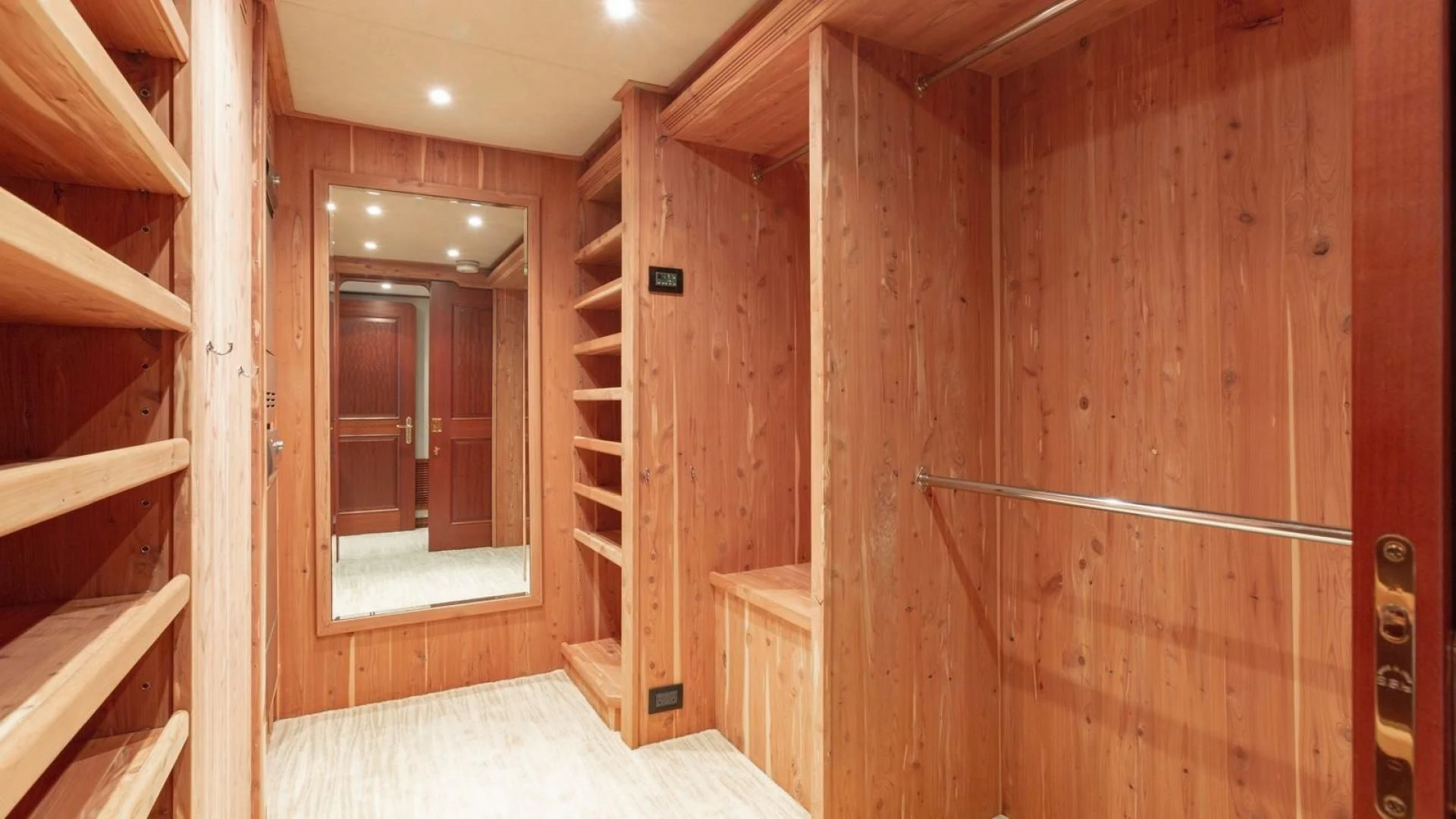 a wooden cabin with a glass door aboard LEGACY Yacht for Sale