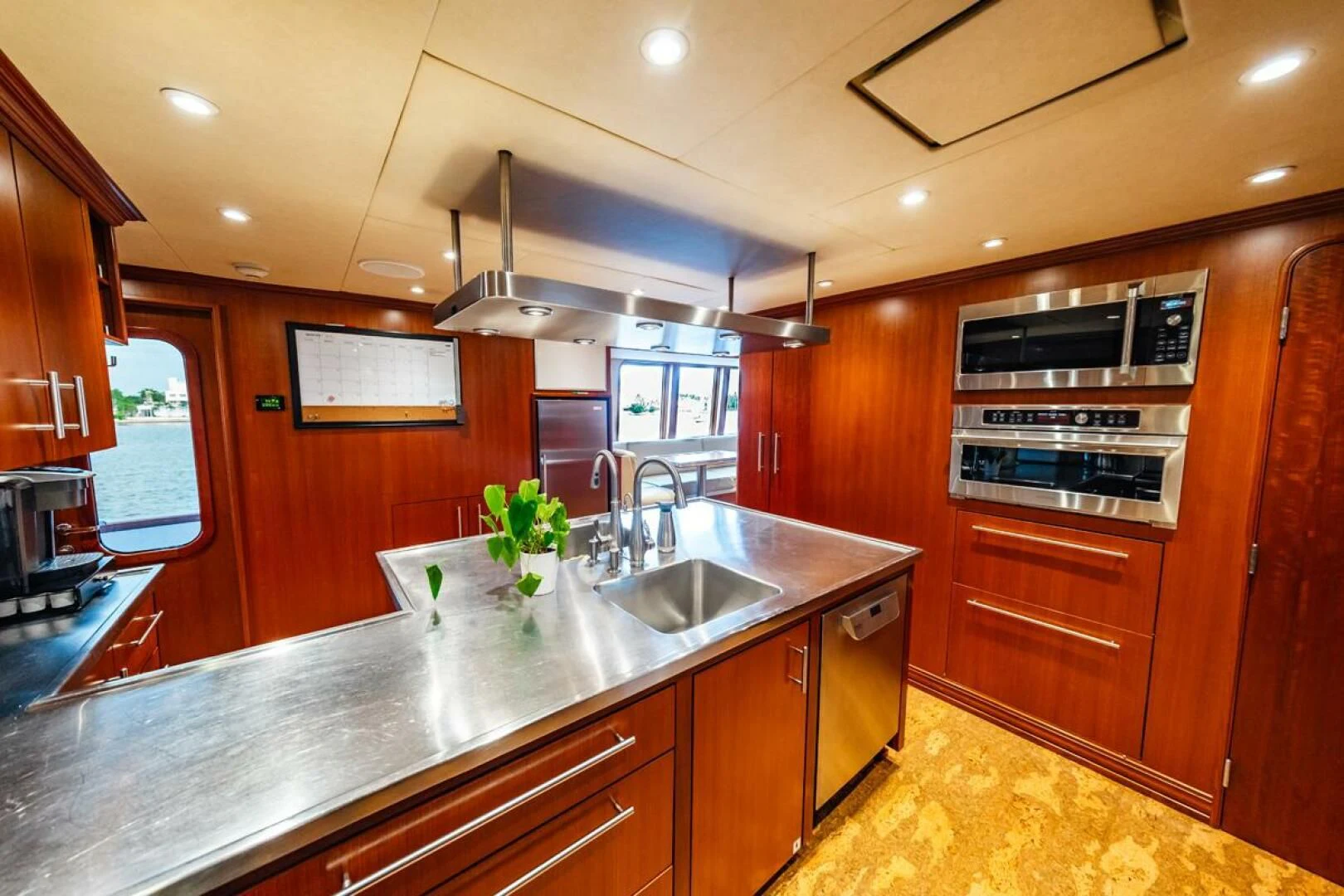 a kitchen with wooden cabinets aboard LEGACY Yacht for Sale