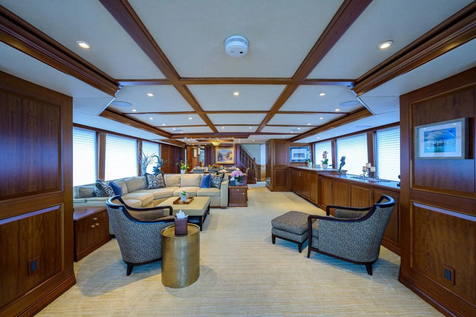 a living room with a couch and a coffee table aboard LEGACY Yacht for Sale