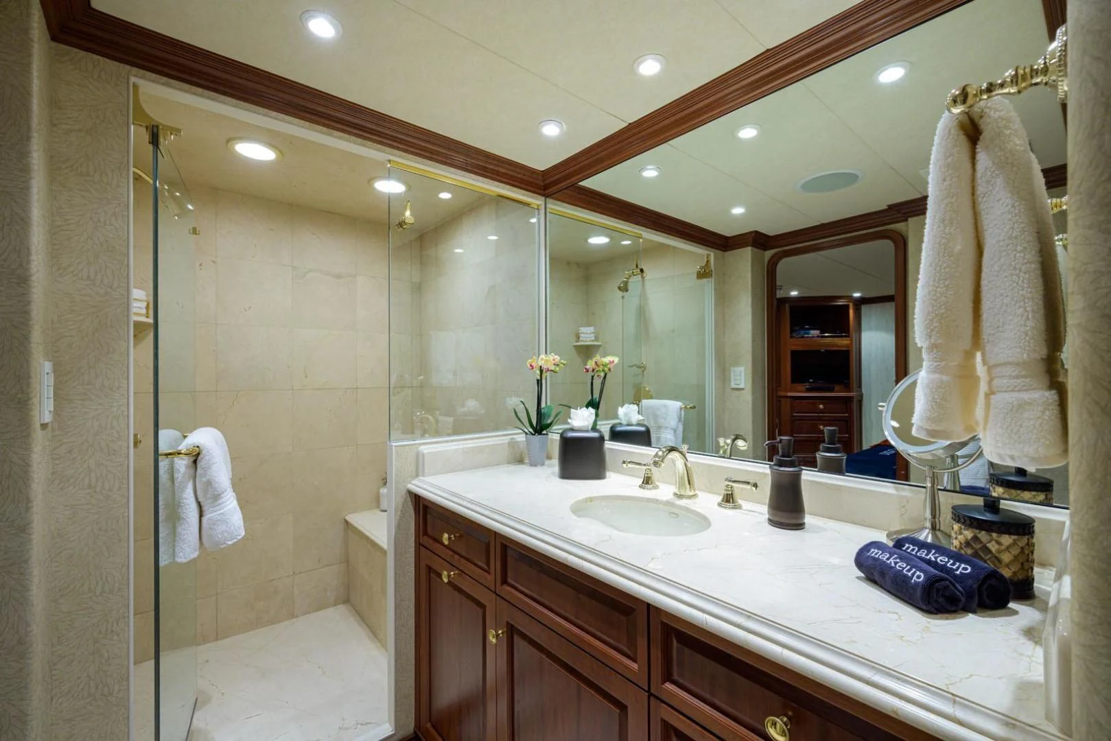 a bathroom with a glass shower aboard LEGACY Yacht for Sale
