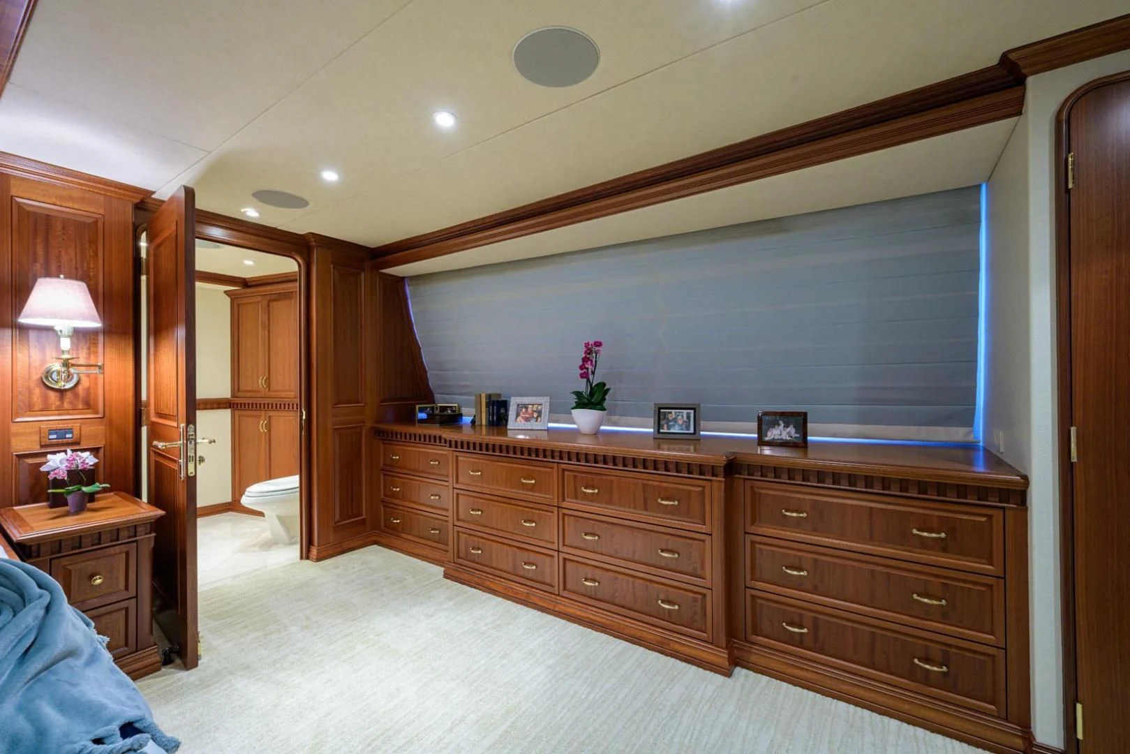 a large kitchen with wooden cabinets aboard LEGACY Yacht for Sale
