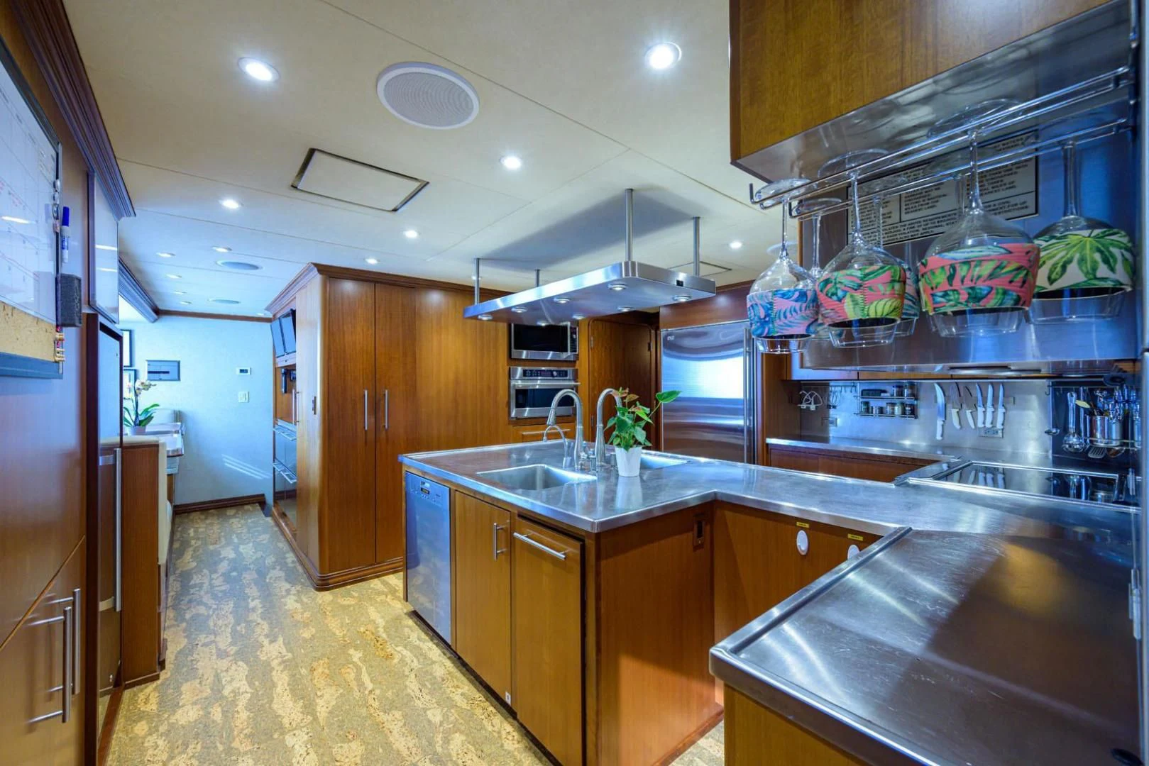 a kitchen with a large island aboard LEGACY Yacht for Sale