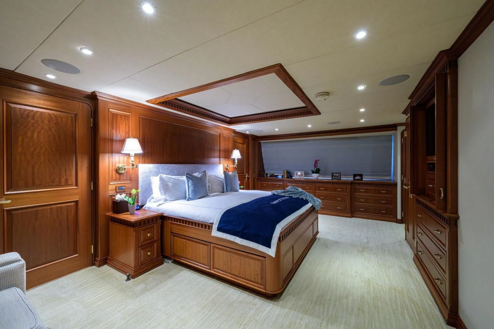 a large bedroom with a large bed aboard LEGACY Yacht for Sale