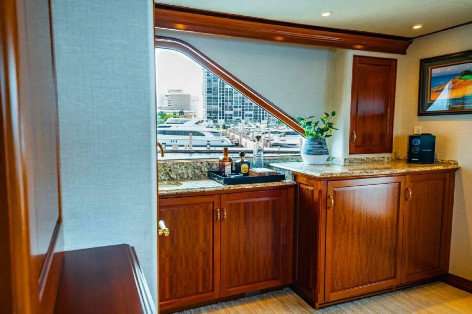 a kitchen with a large window aboard LEGACY Yacht for Sale
