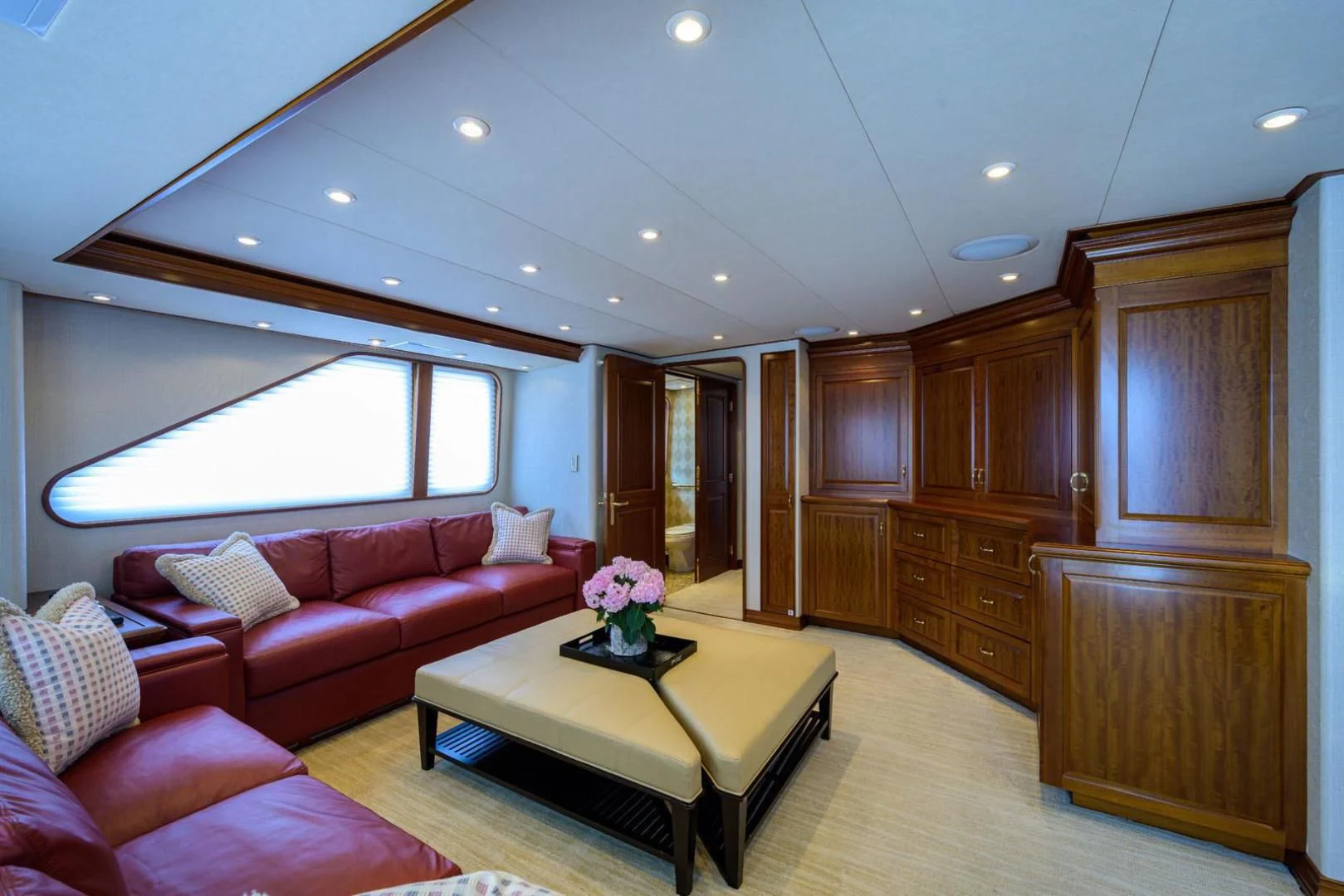 a living room with a couch and a table aboard LEGACY Yacht for Sale