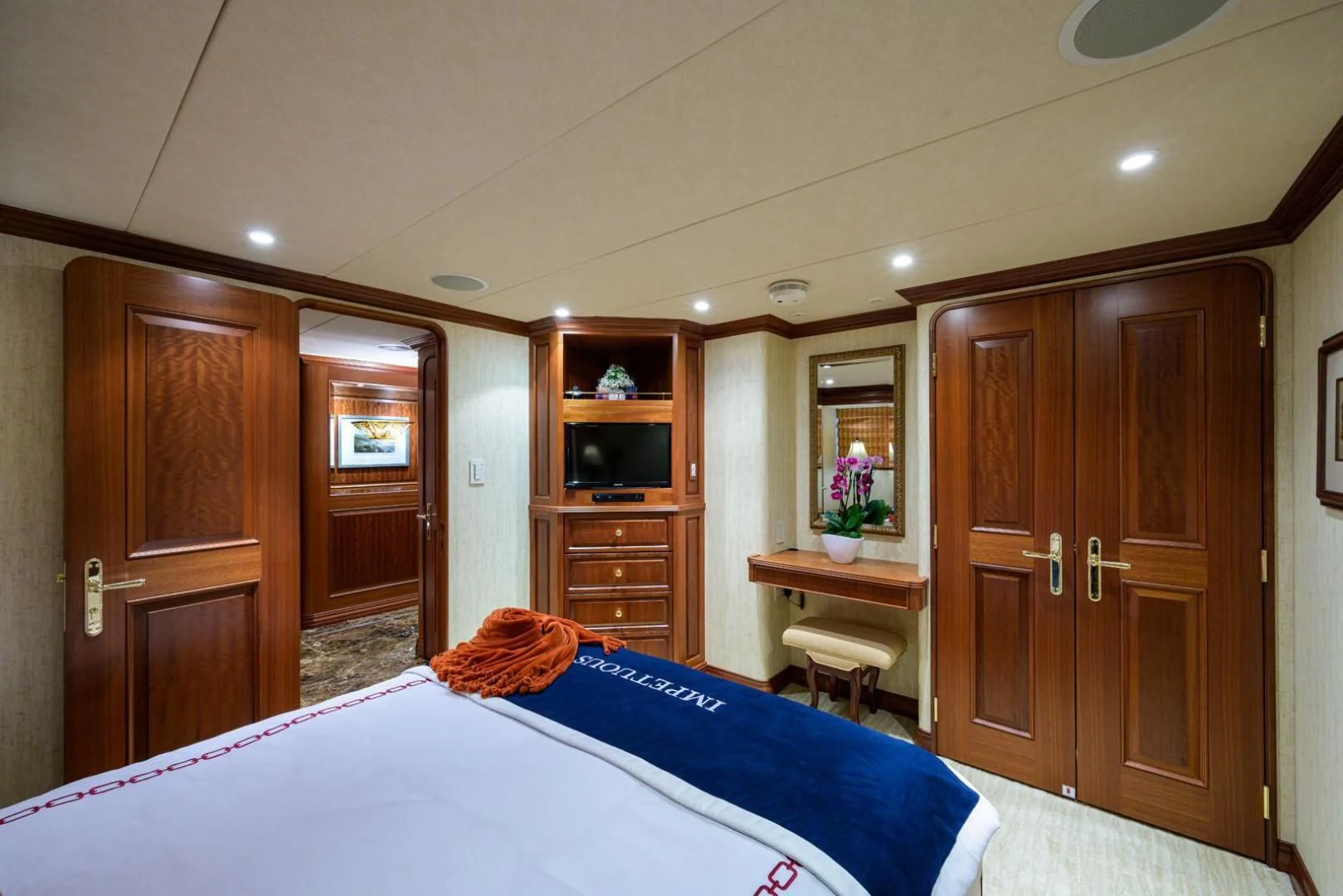 a bedroom with a bed and cabinets aboard LEGACY Yacht for Sale