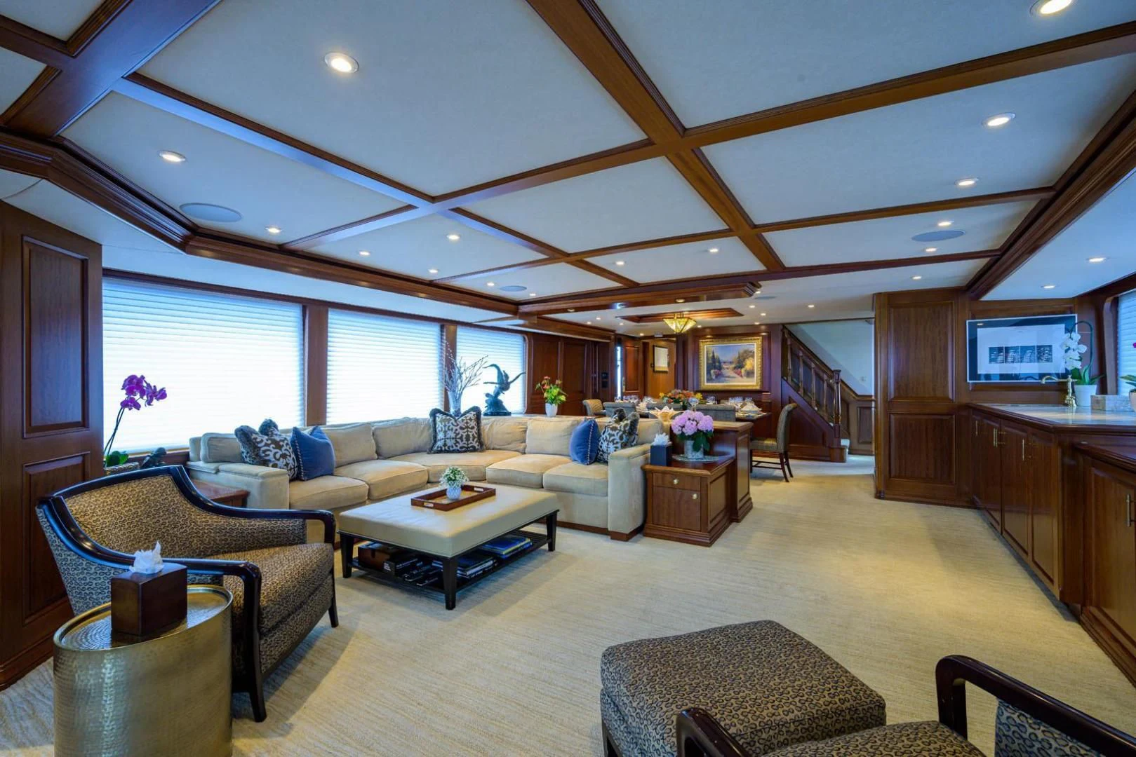 a living room with a large window aboard LEGACY Yacht for Sale