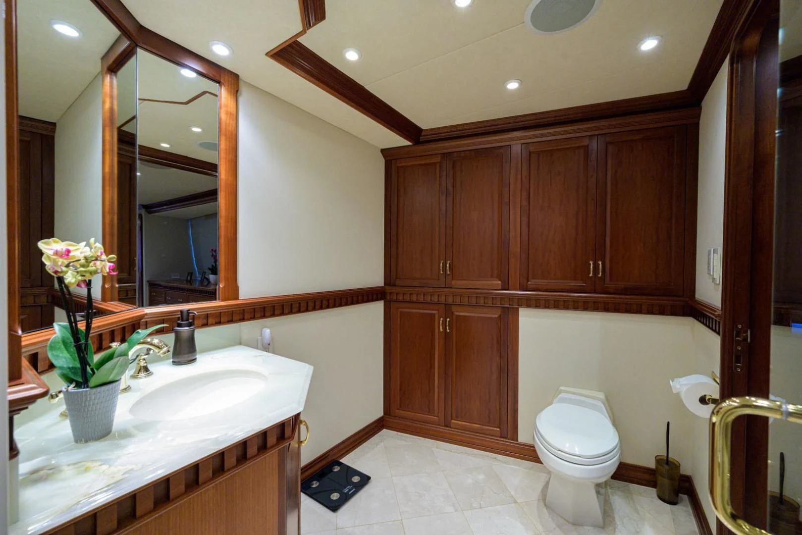 a bathroom with wooden cabinets aboard LEGACY Yacht for Sale