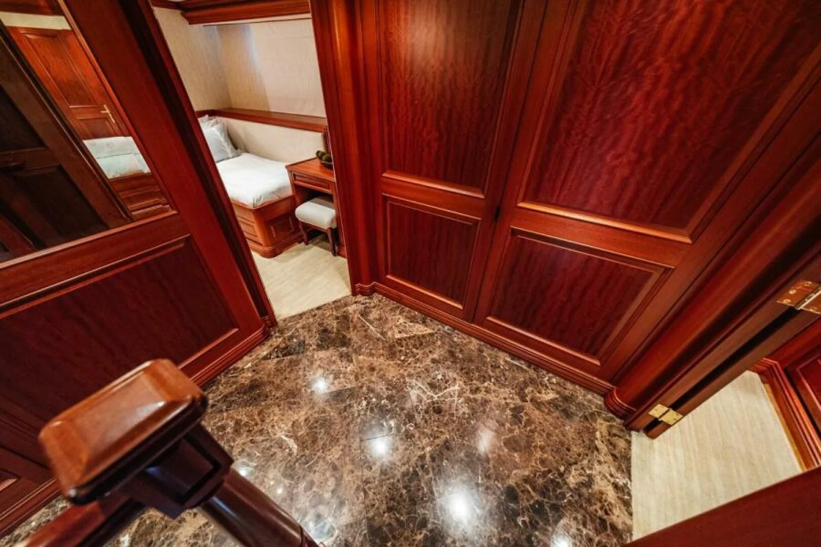 a room with a rug and a chair aboard LEGACY Yacht for Sale
