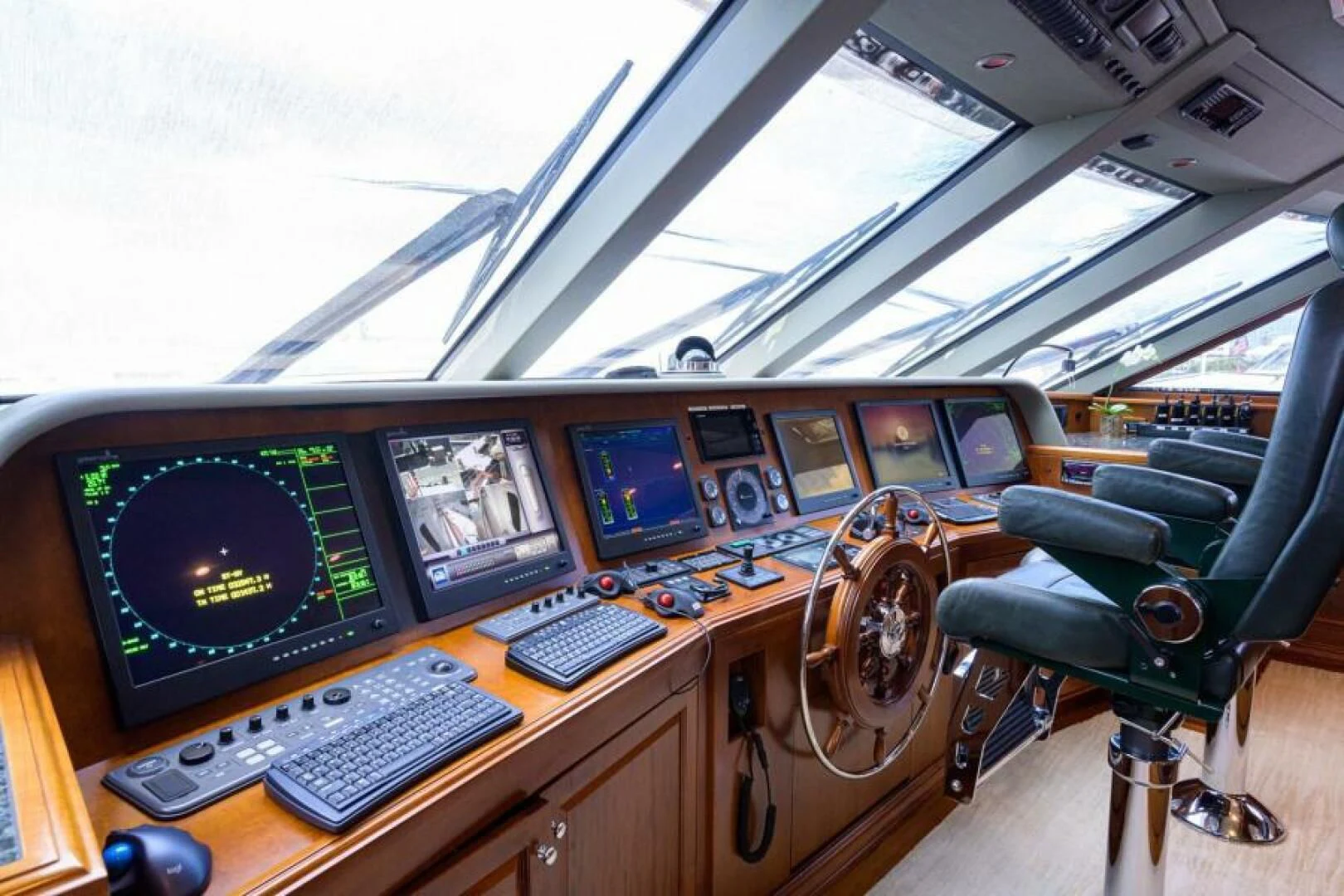 a cockpit with many monitors and keyboards aboard LEGACY Yacht for Sale