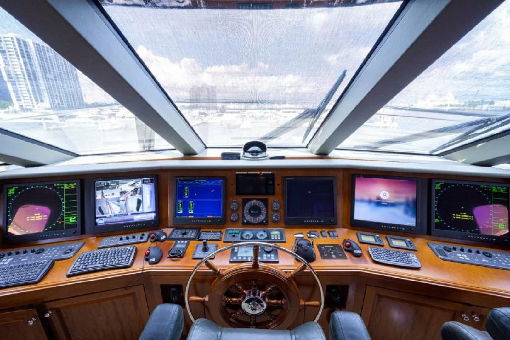a control room with many monitors aboard LEGACY Yacht for Sale