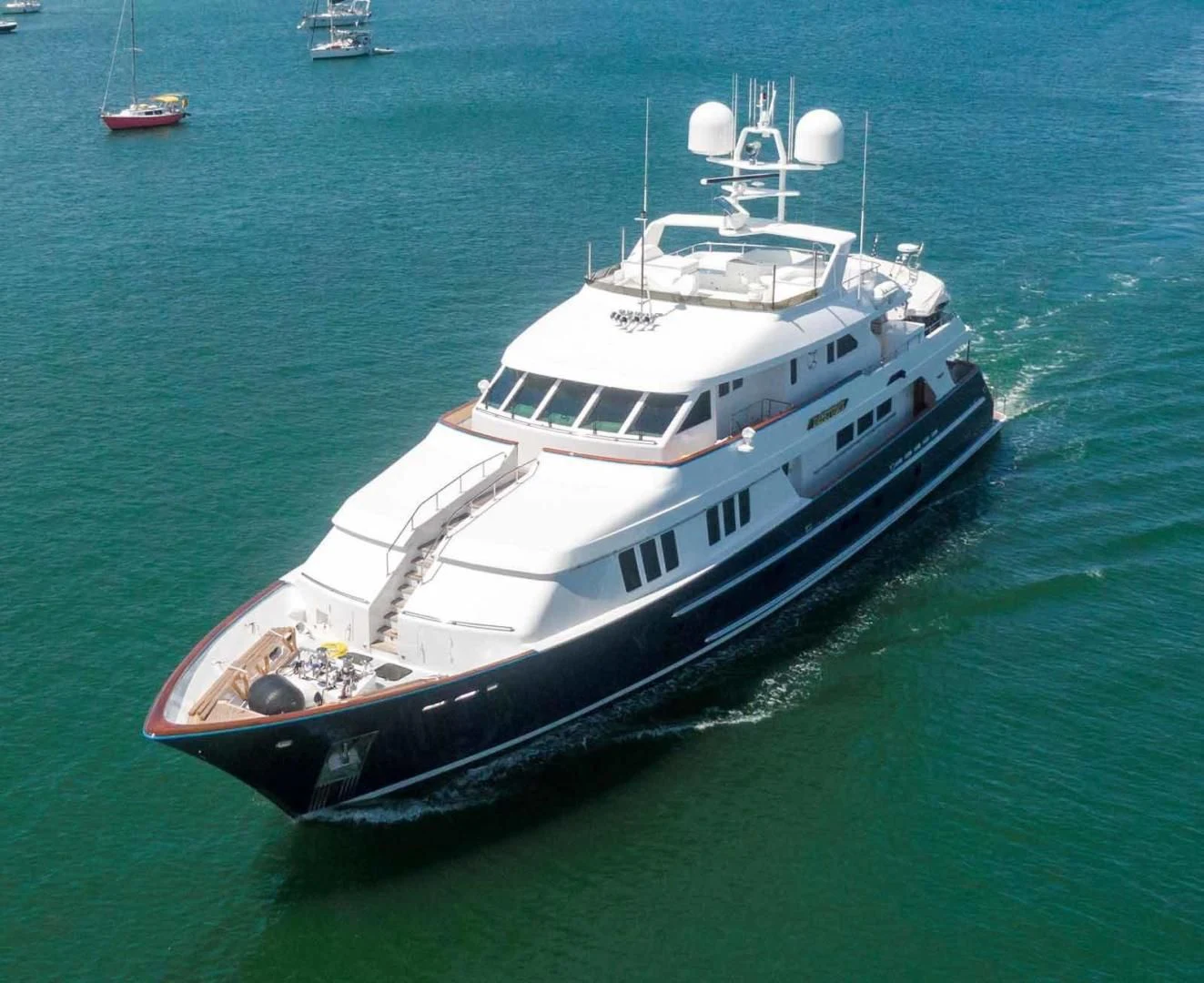 a large white ship in the water aboard LEGACY Yacht for Sale