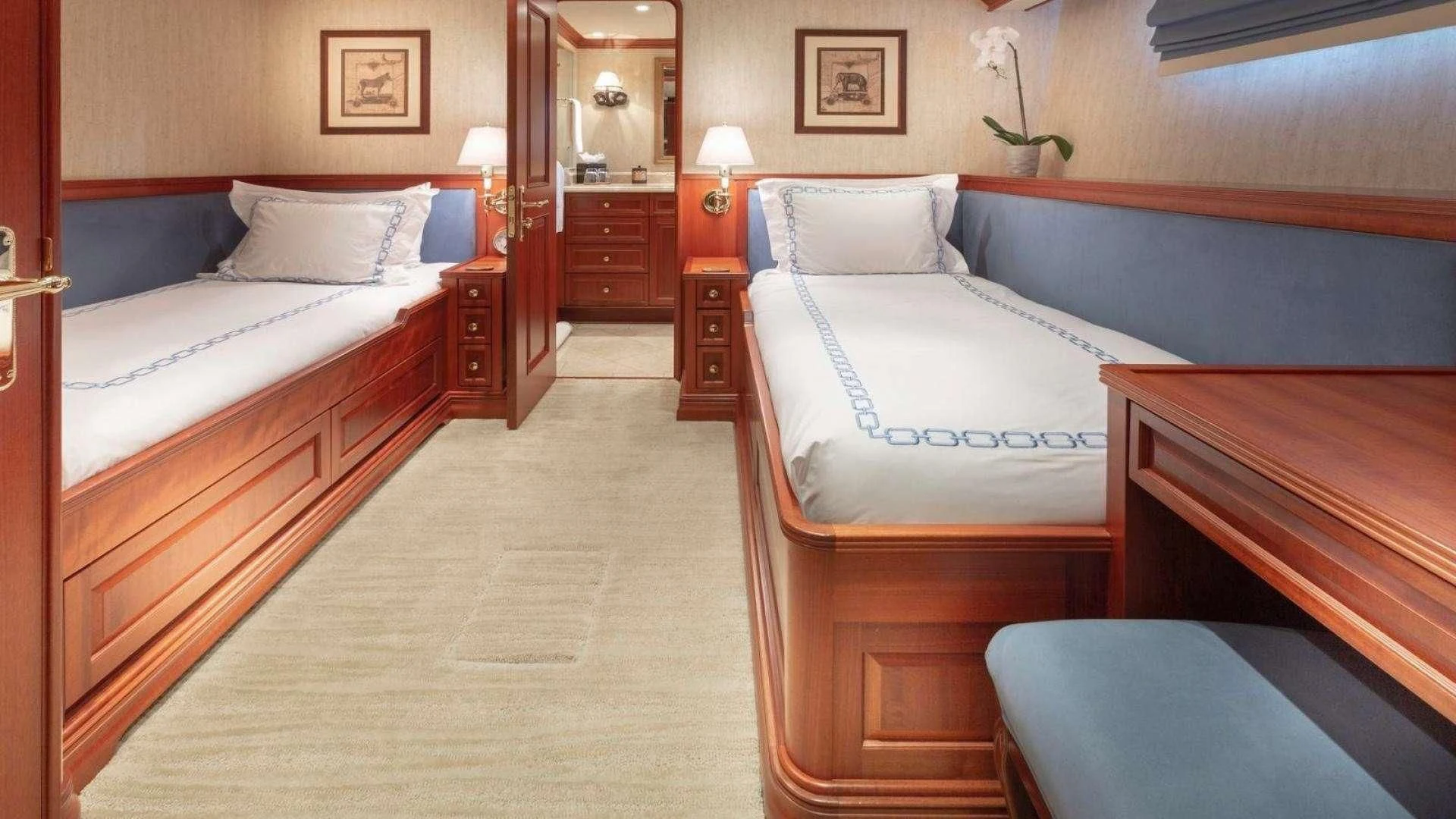 a room with beds and a mirror aboard LEGACY Yacht for Sale