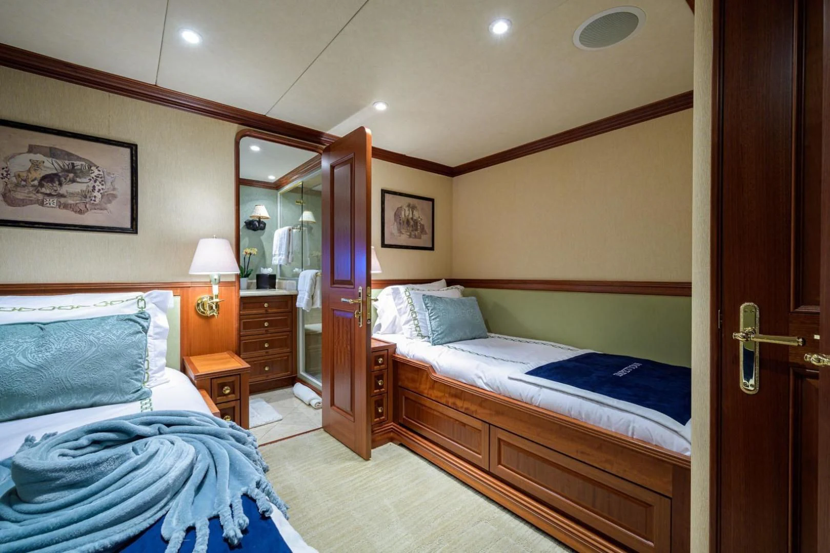 a couple of beds in a hotel room aboard LEGACY Yacht for Sale