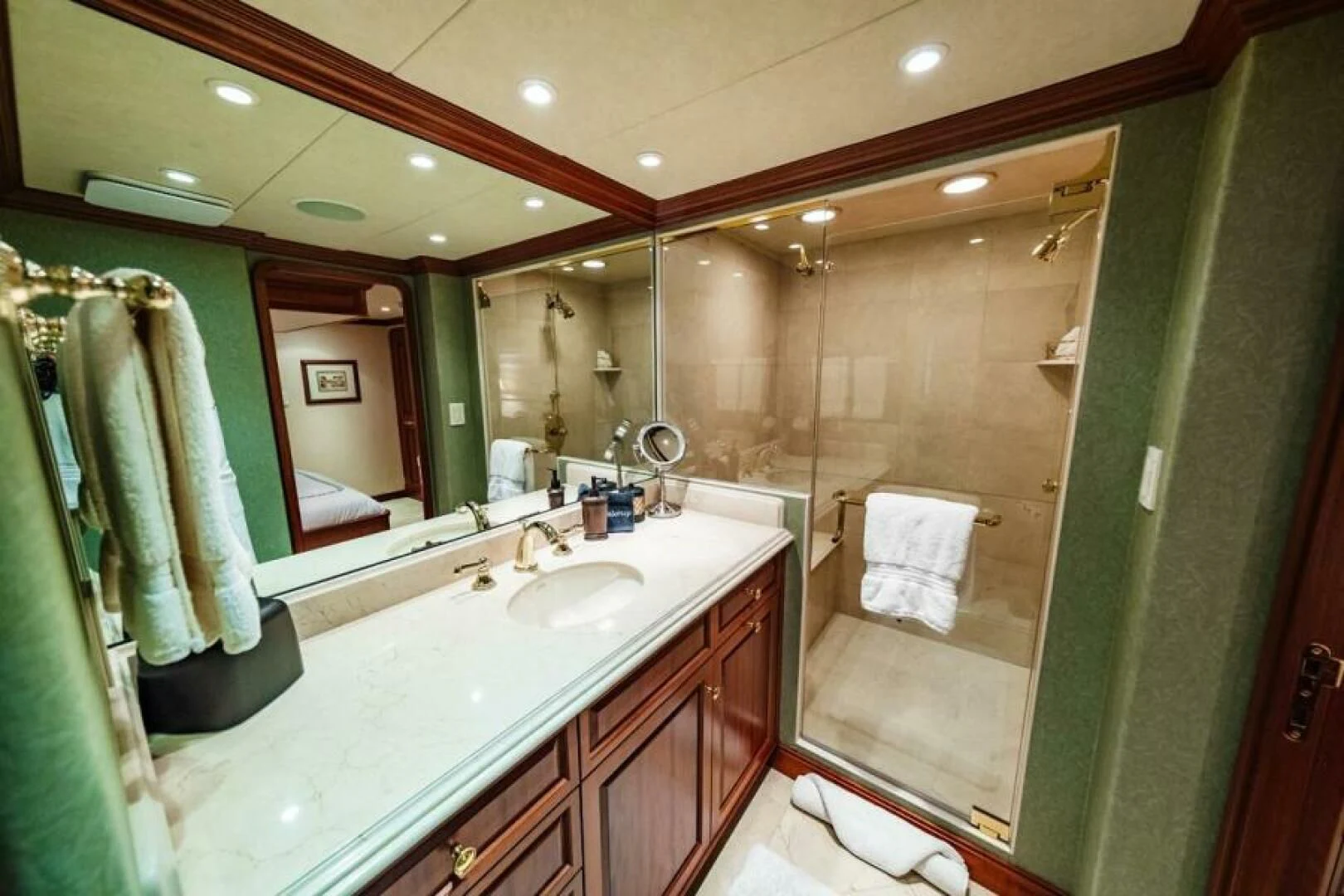 a bathroom with a large mirror aboard LEGACY Yacht for Sale