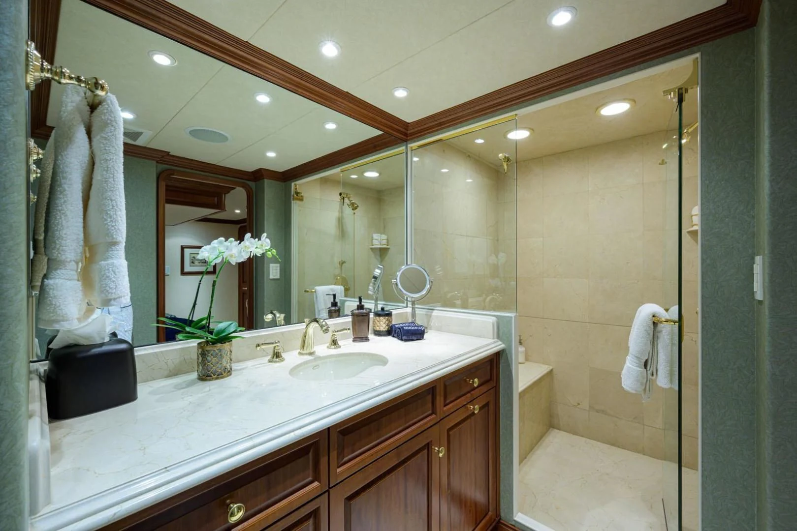 a bathroom with a large mirror aboard LEGACY Yacht for Sale