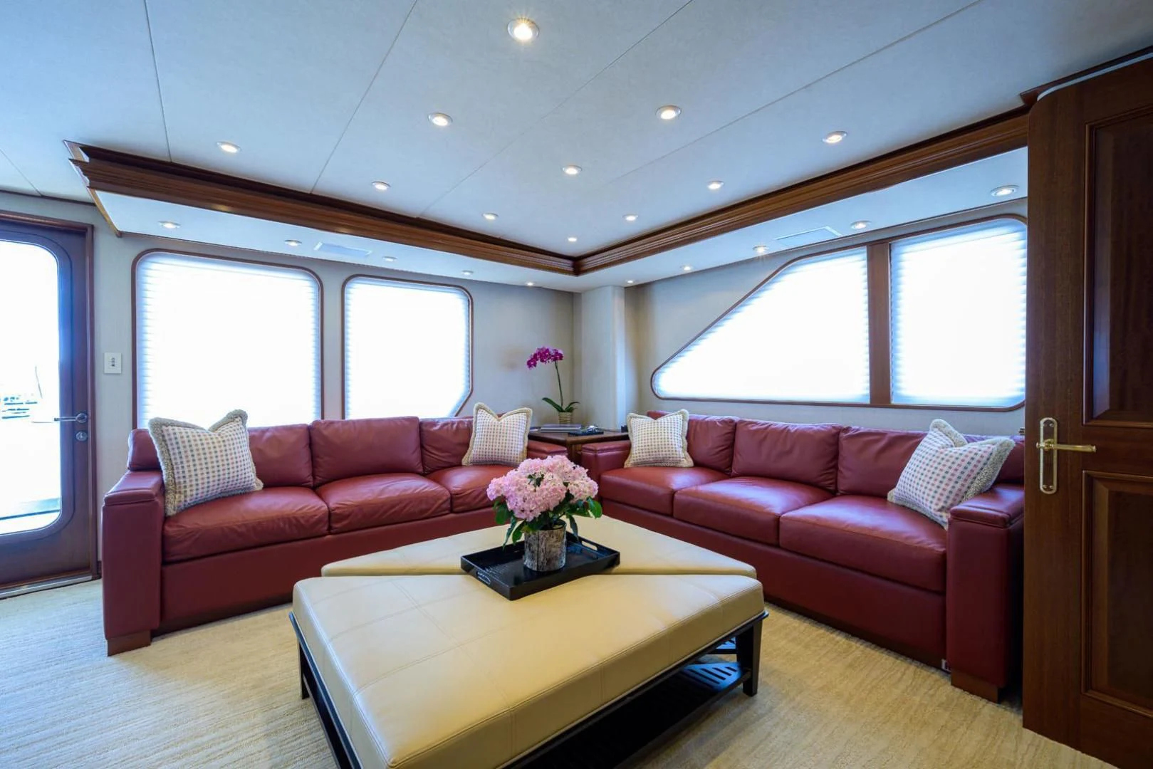 a living room with a couch and a table aboard LEGACY Yacht for Sale
