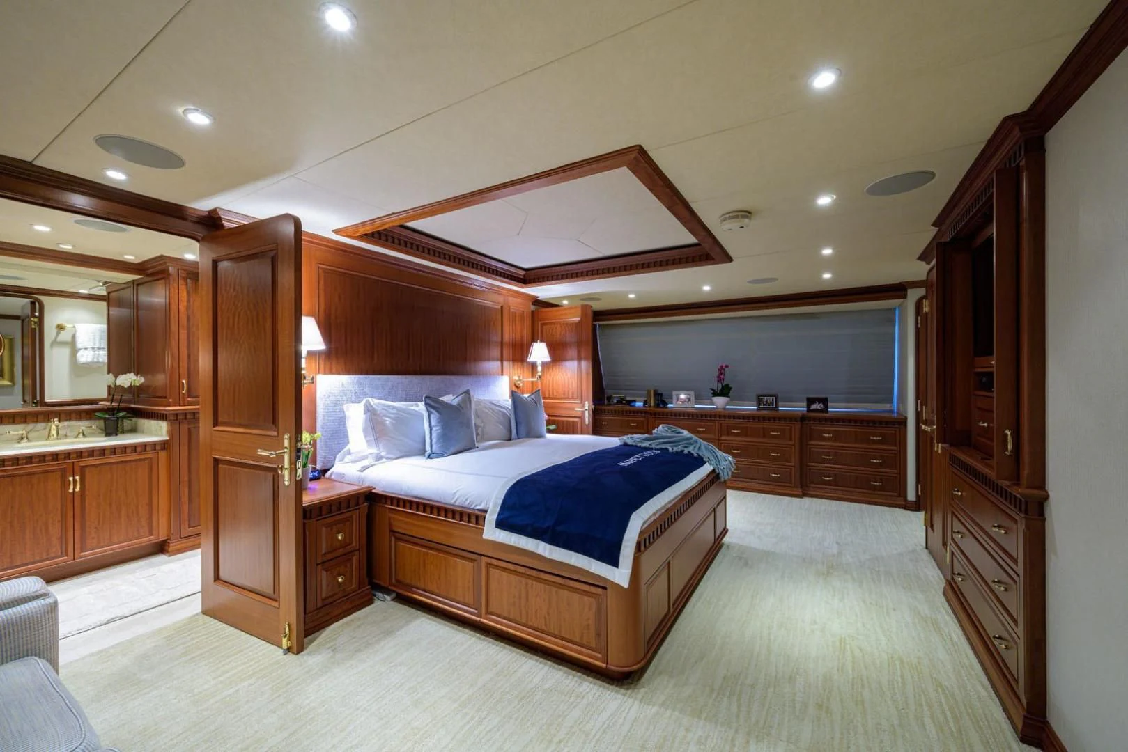 a large bedroom with a large bed aboard LEGACY Yacht for Sale
