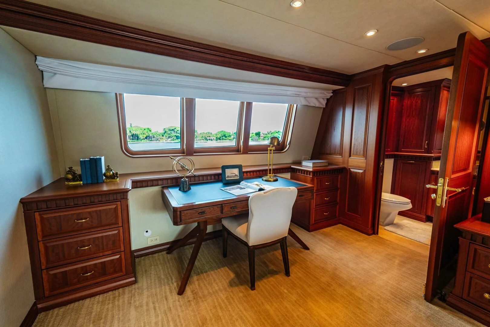 a room with a desk and a chair aboard LEGACY Yacht for Sale