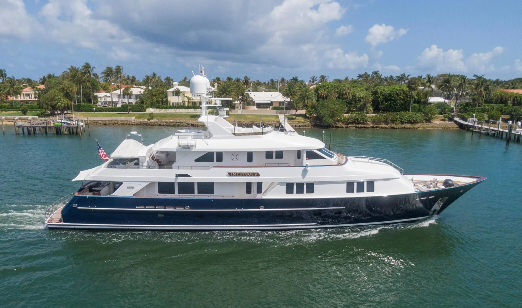 a large white boat in the water aboard LEGACY Yacht for Sale