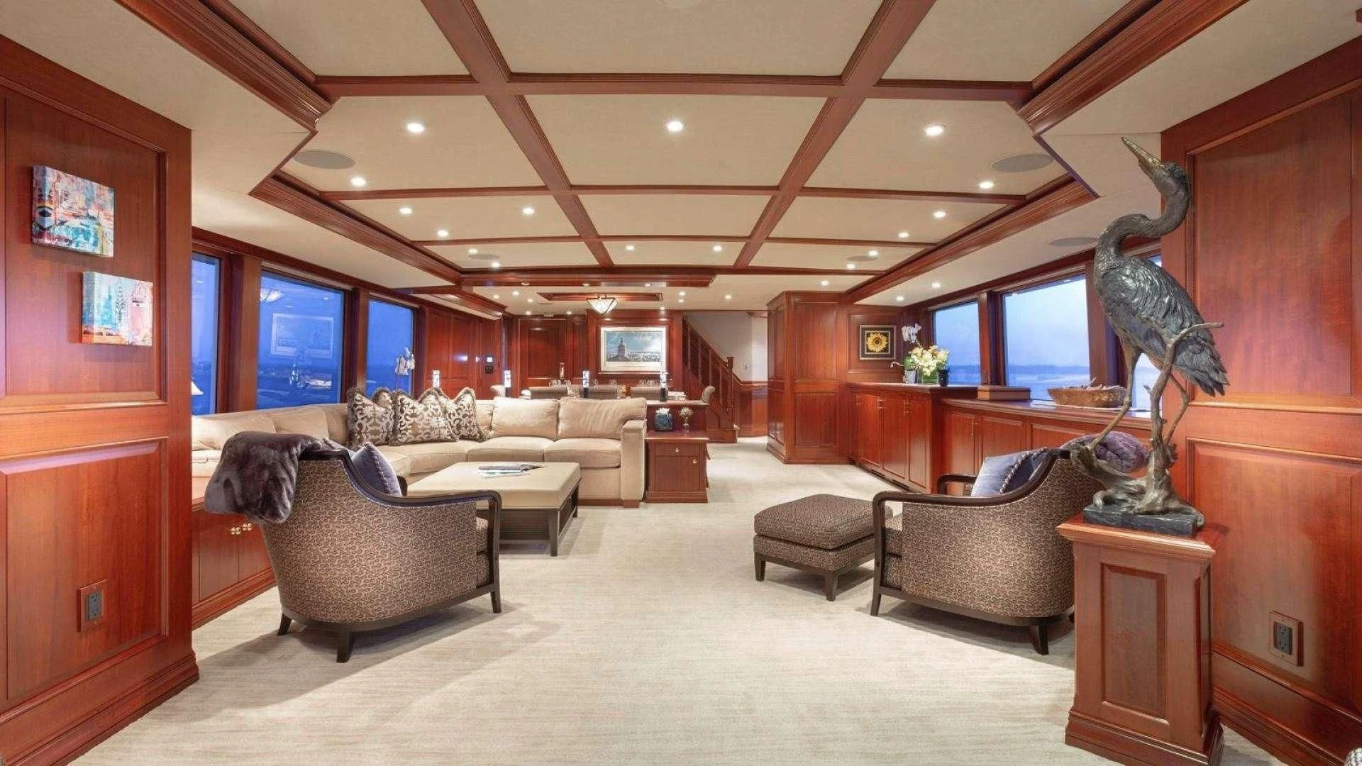 a room with a couch and a tv aboard LEGACY Yacht for Sale