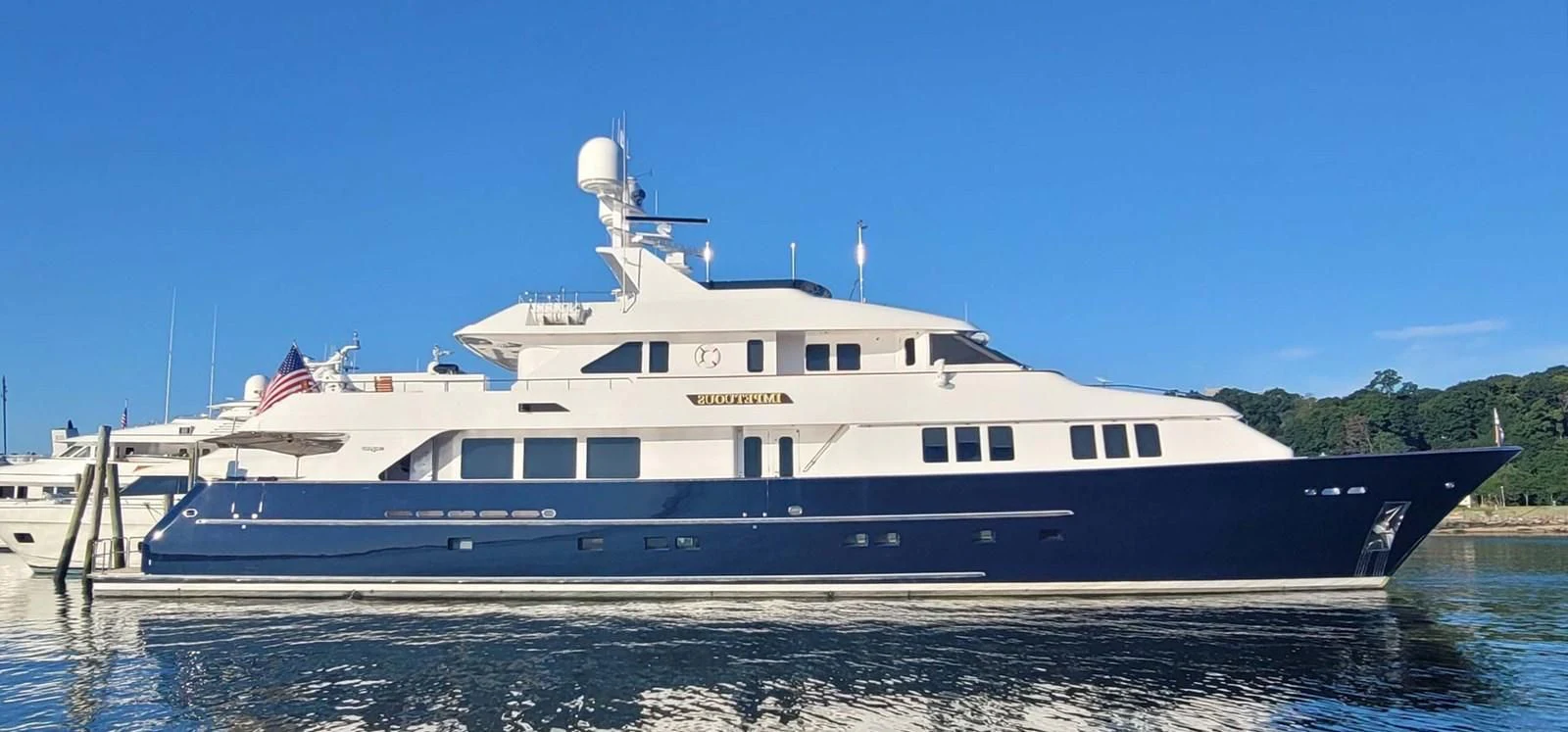 a large white boat aboard LEGACY Yacht for Sale
