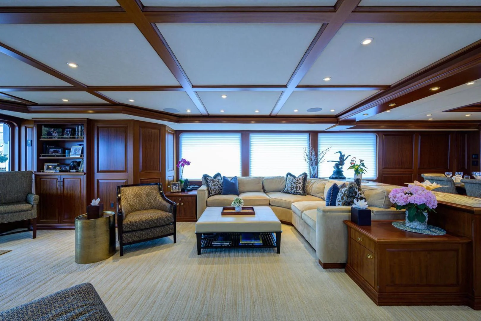 a living room with a couch and a coffee table aboard LEGACY Yacht for Sale