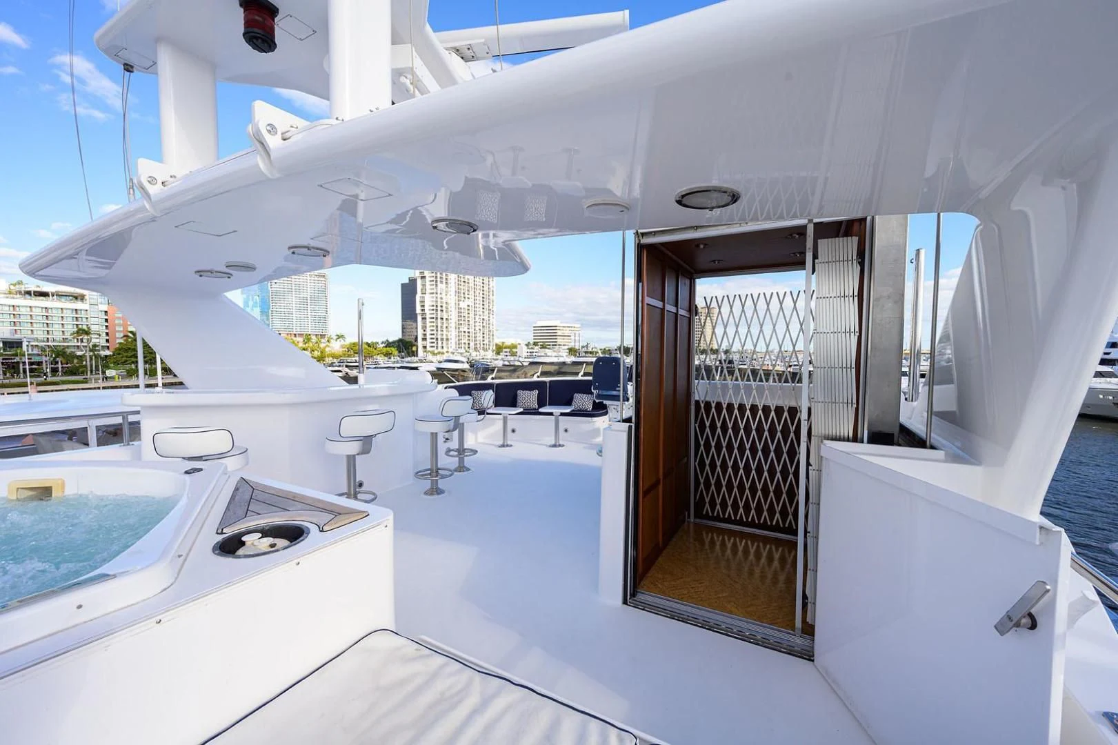 a large white building with a large window and a pool aboard LEGACY Yacht for Sale