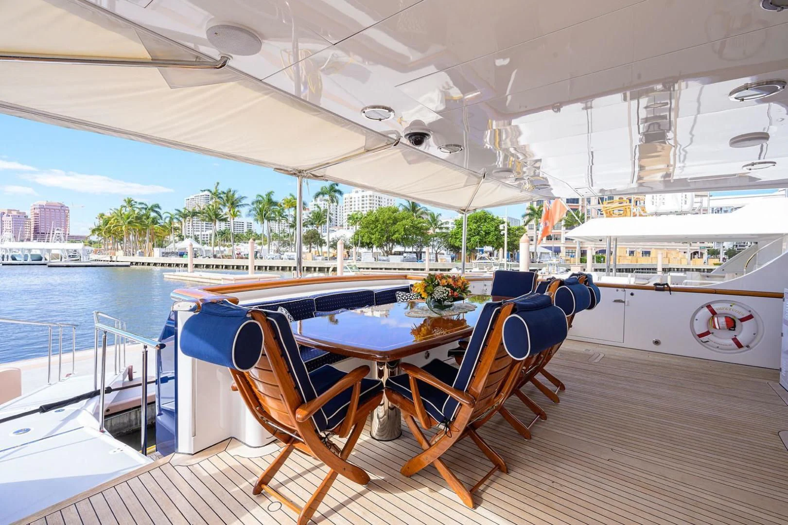 a table and chairs on a boat aboard LEGACY Yacht for Sale