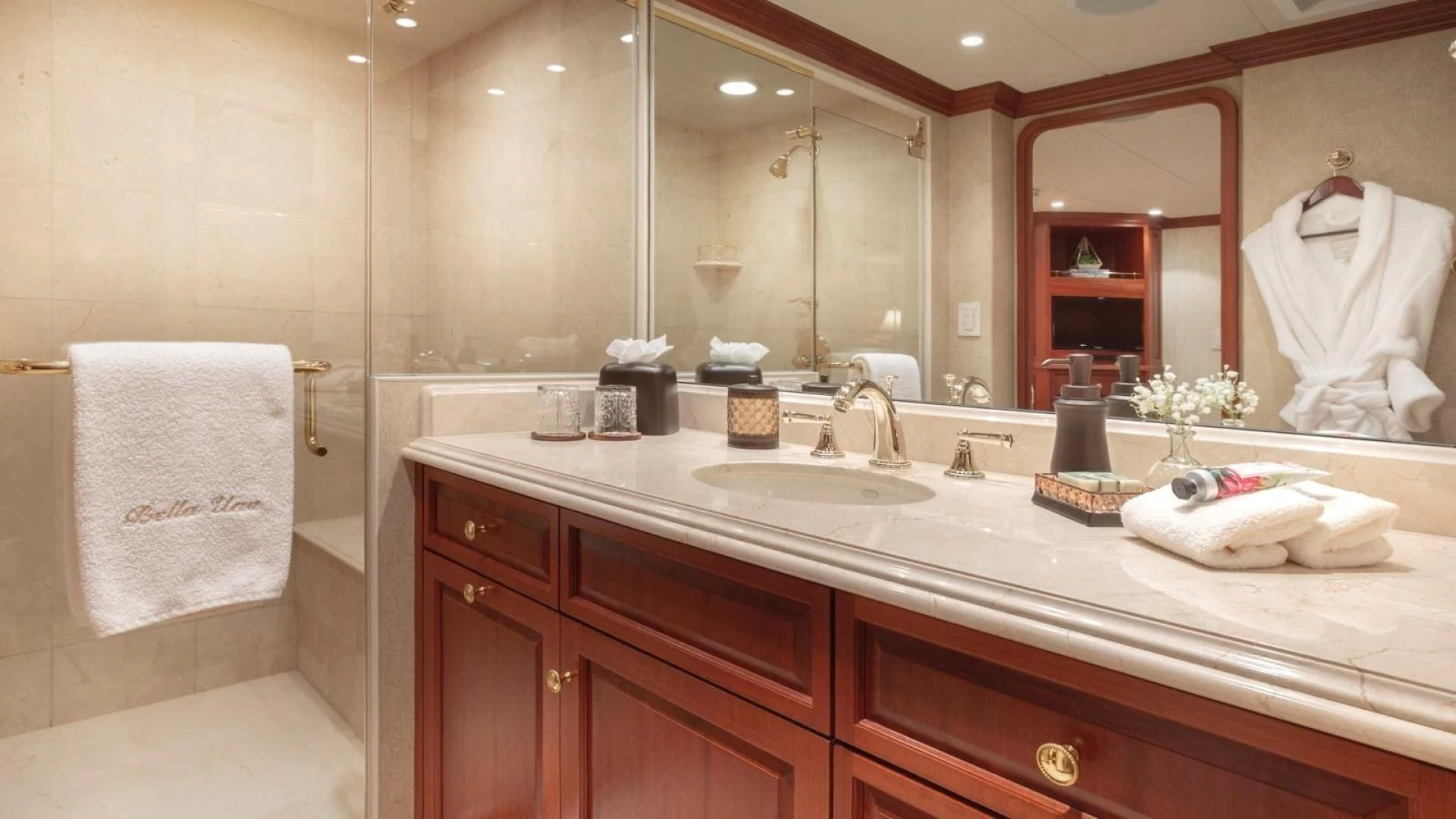 a bathroom with a large mirror aboard LEGACY Yacht for Sale