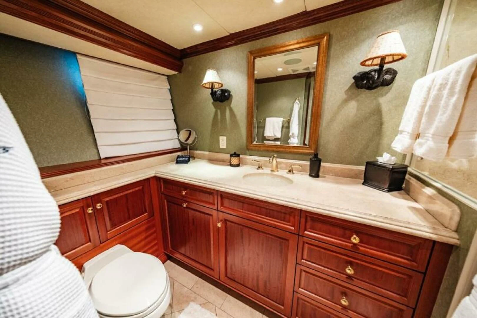 a bathroom with a large mirror aboard LEGACY Yacht for Sale