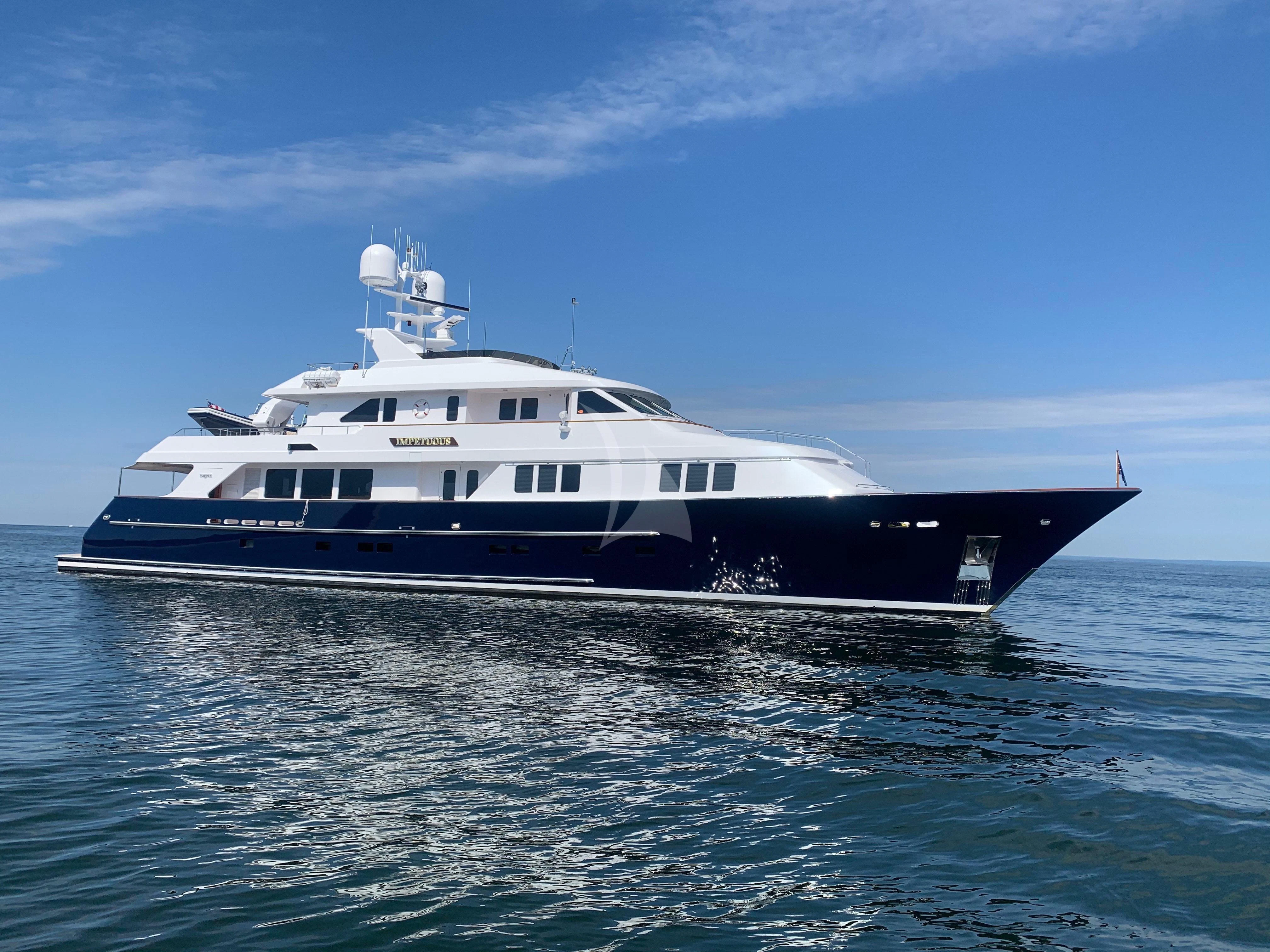 a large white boat in the water aboard LEGACY Yacht for Sale