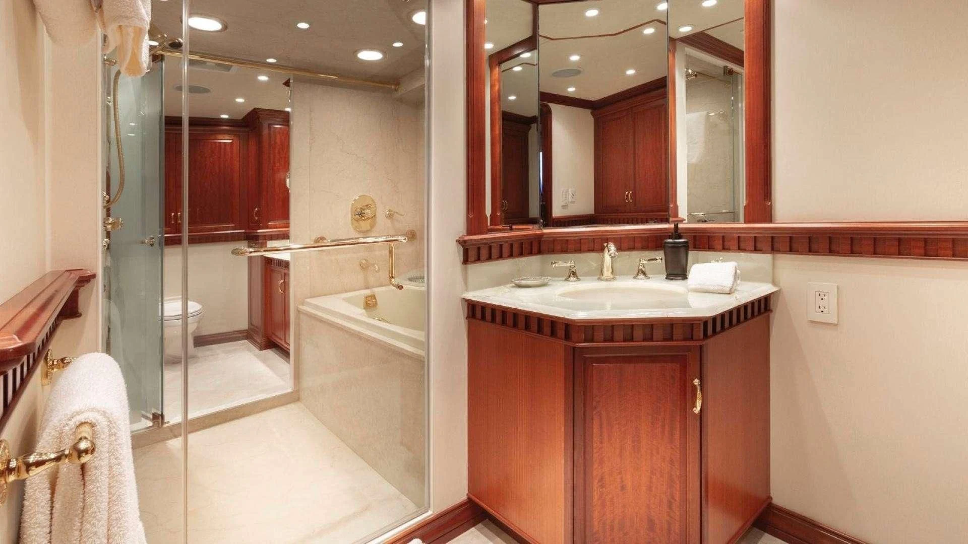 a bathroom with a sink and a bathtub aboard LEGACY Yacht for Sale