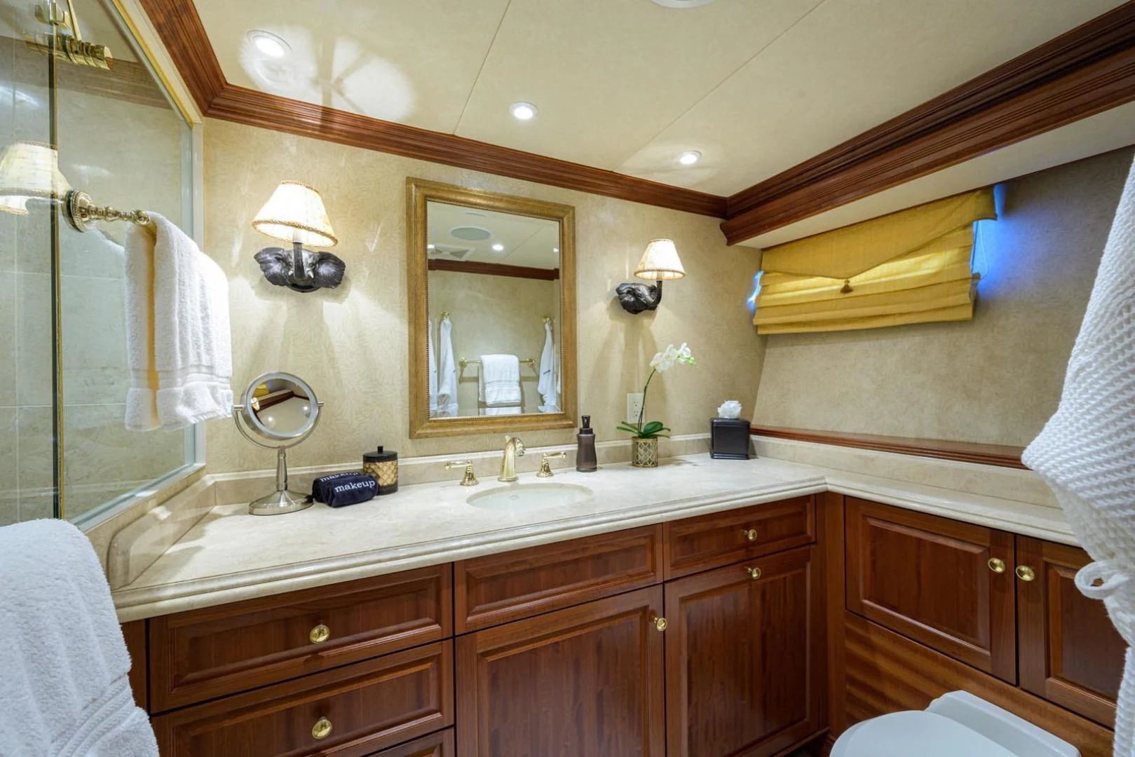 a bathroom with a large mirror aboard LEGACY Yacht for Sale